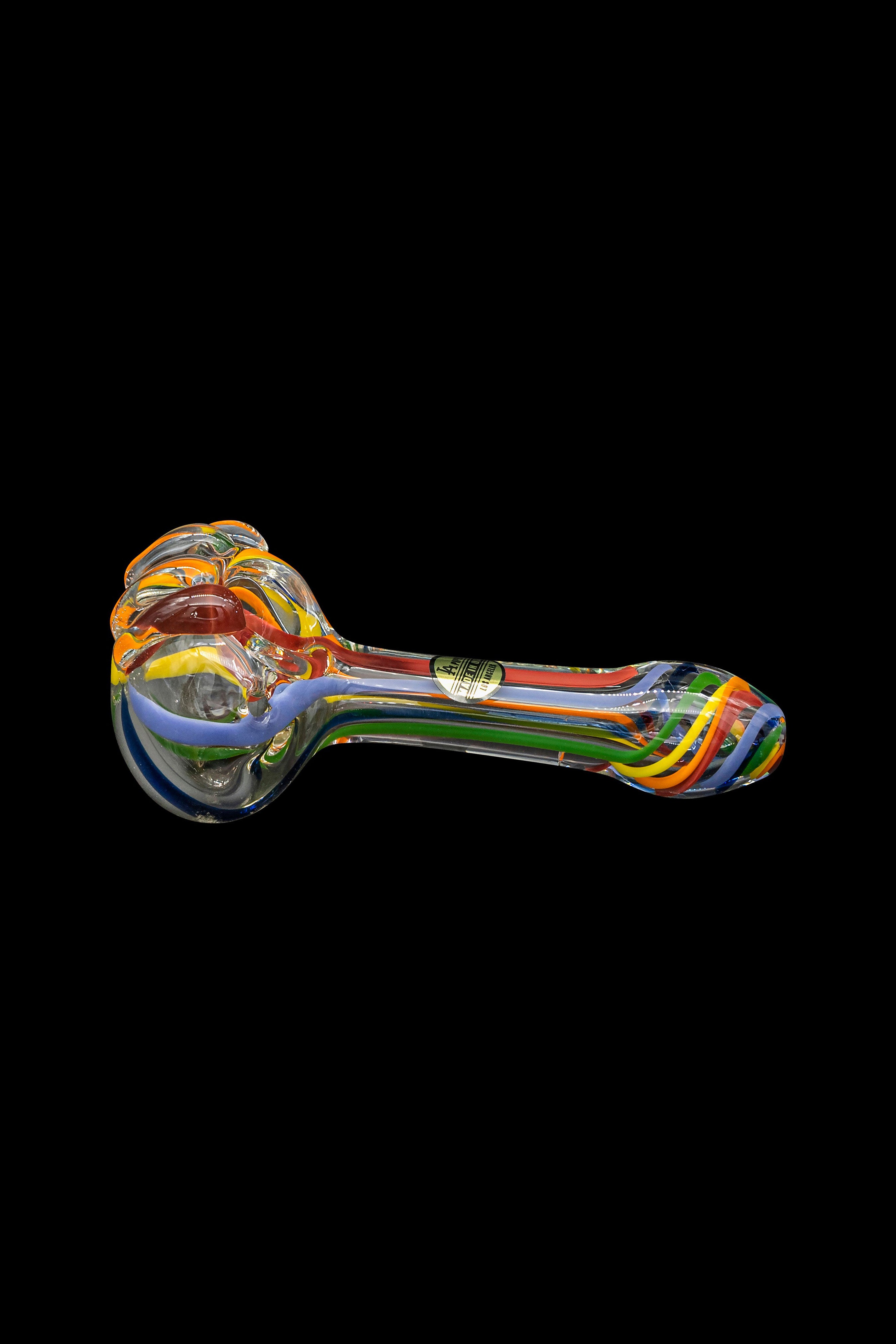 Colorful glass pipe isolated on a black background.