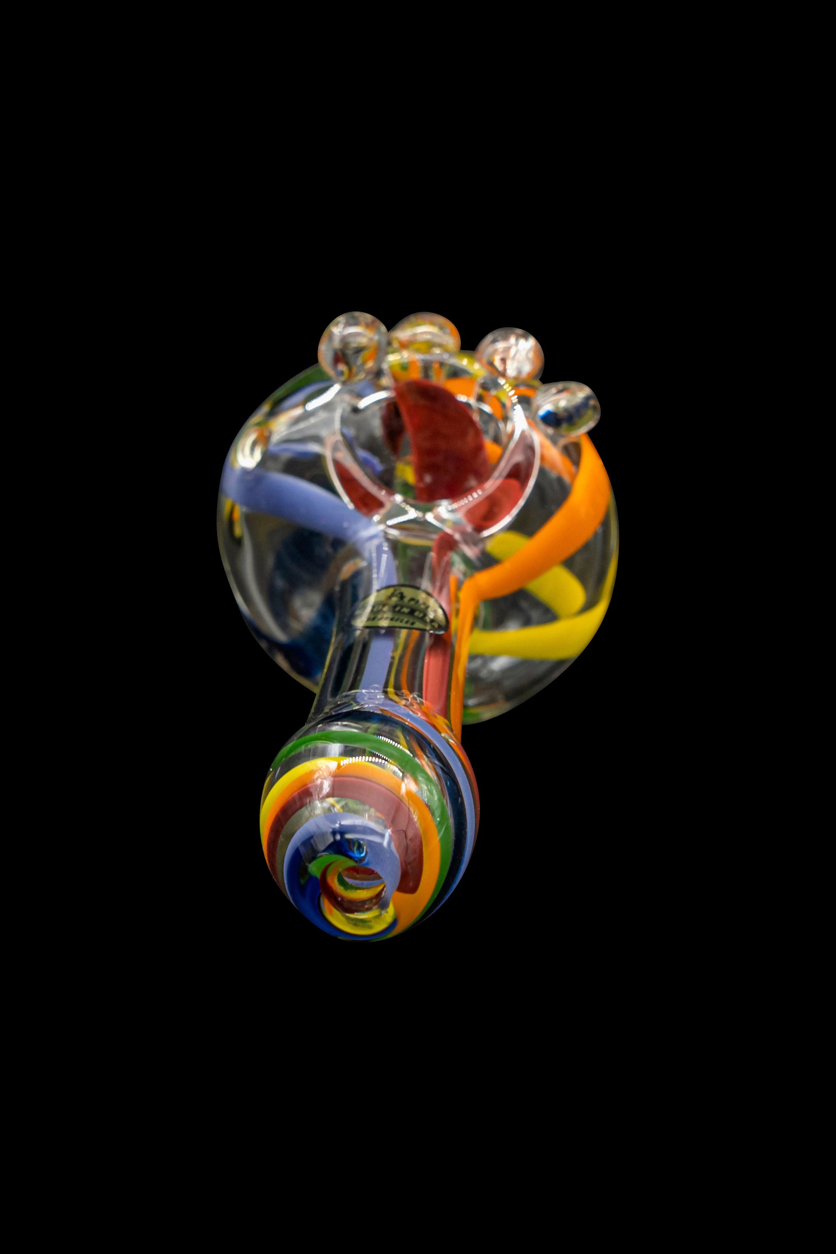 Hand-blown glass cannabis pipe with colorful swirls against a black background.