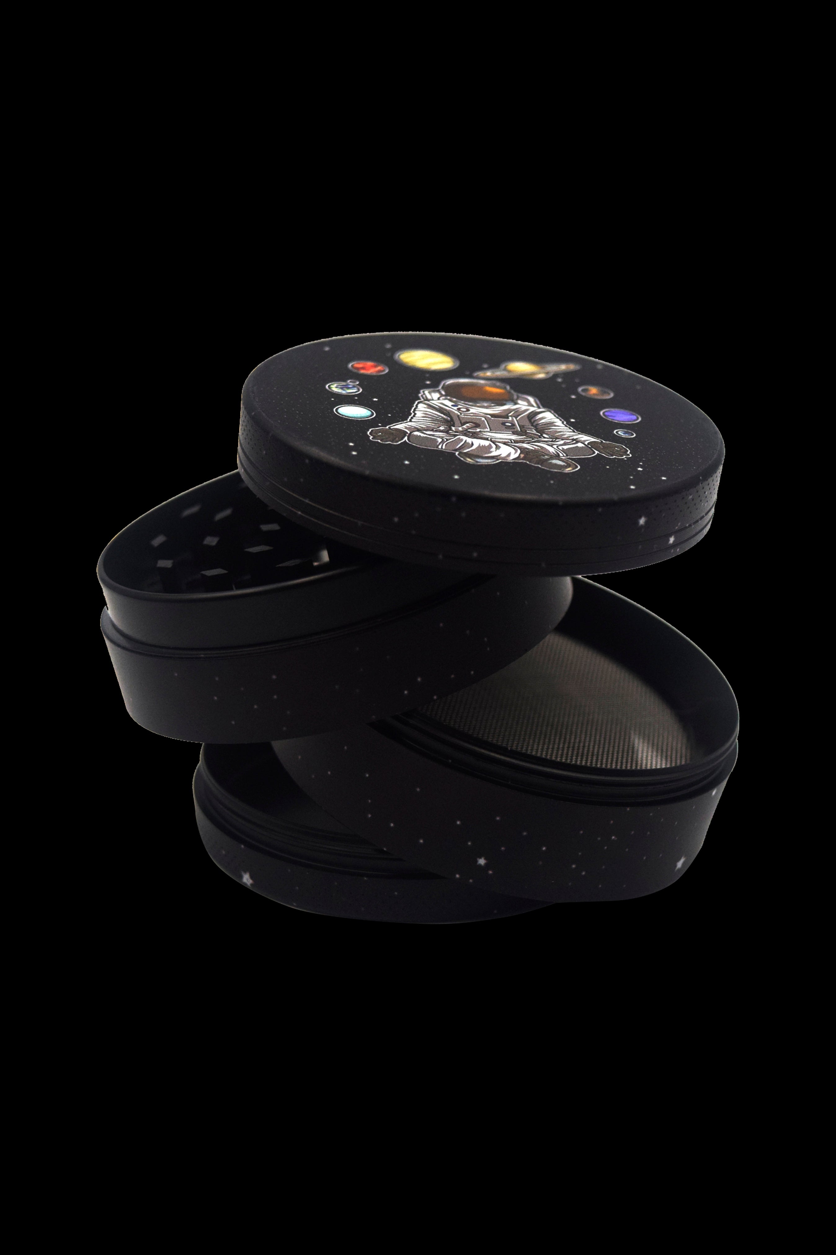 Black four-piece grinder with a space cat design, partially disassembled to reveal the inner mesh screen.
