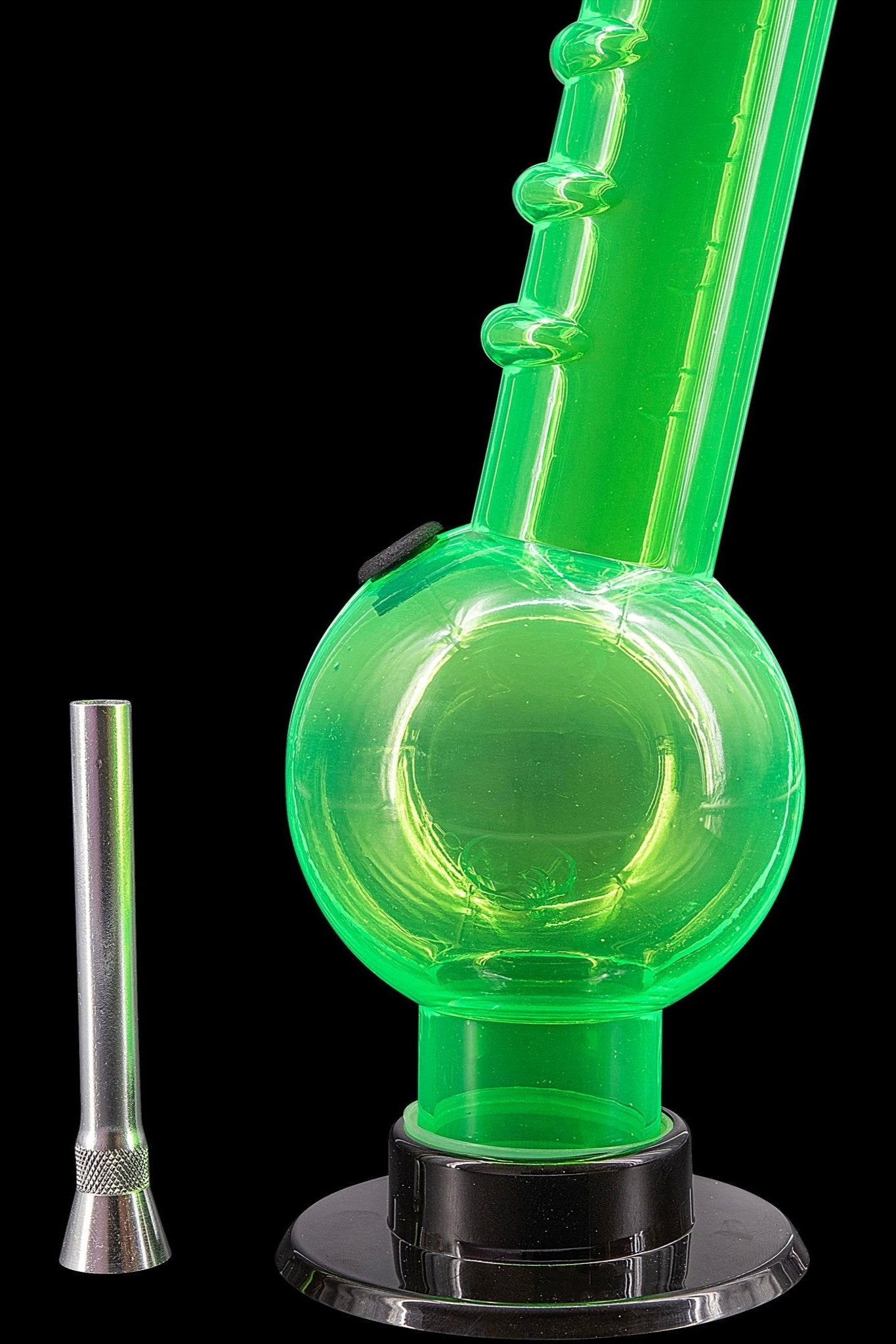 Green glass bubbler with a metal downstem, isolated on a black background.