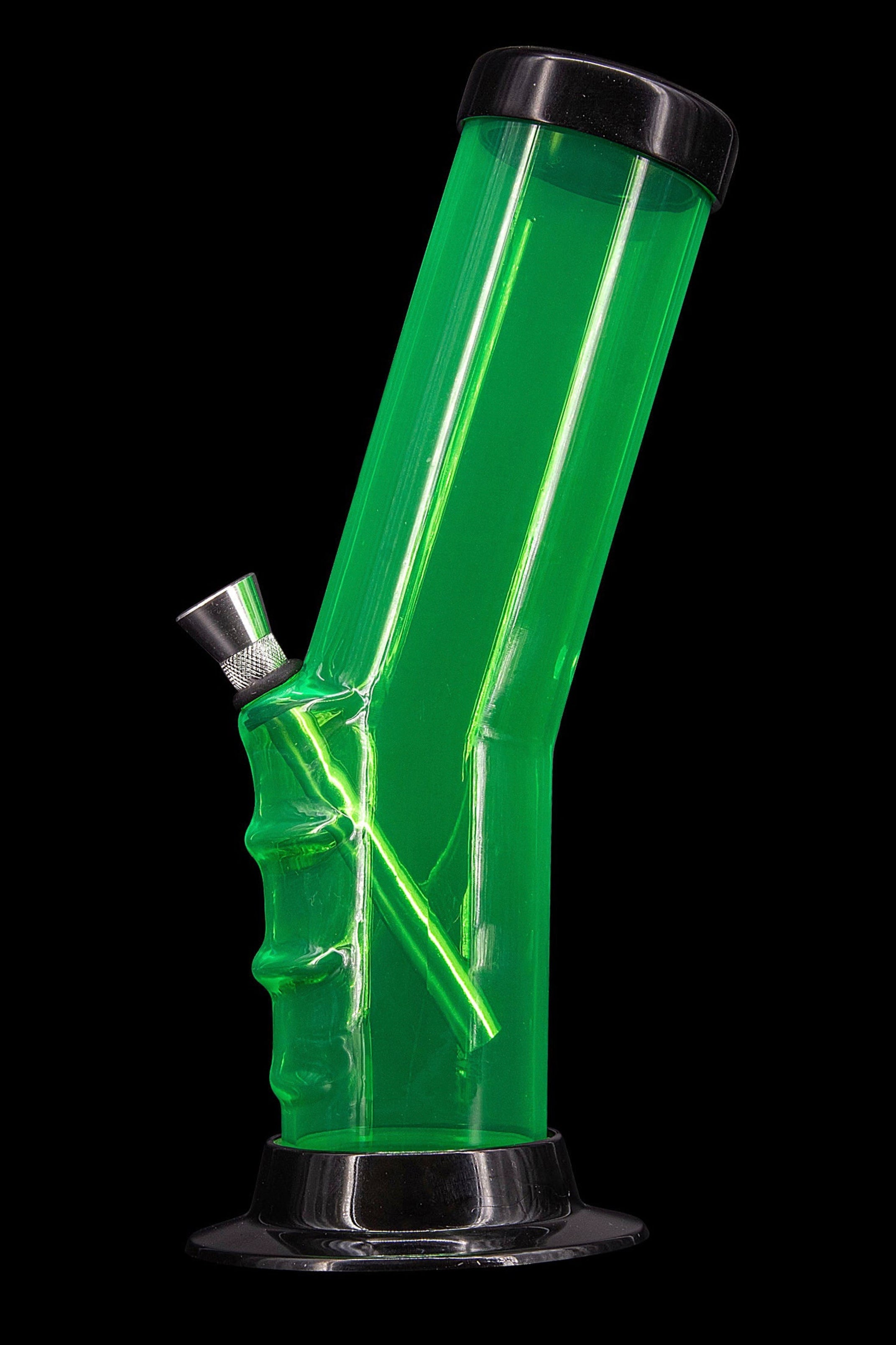 Green acrylic water pipe against a black background.