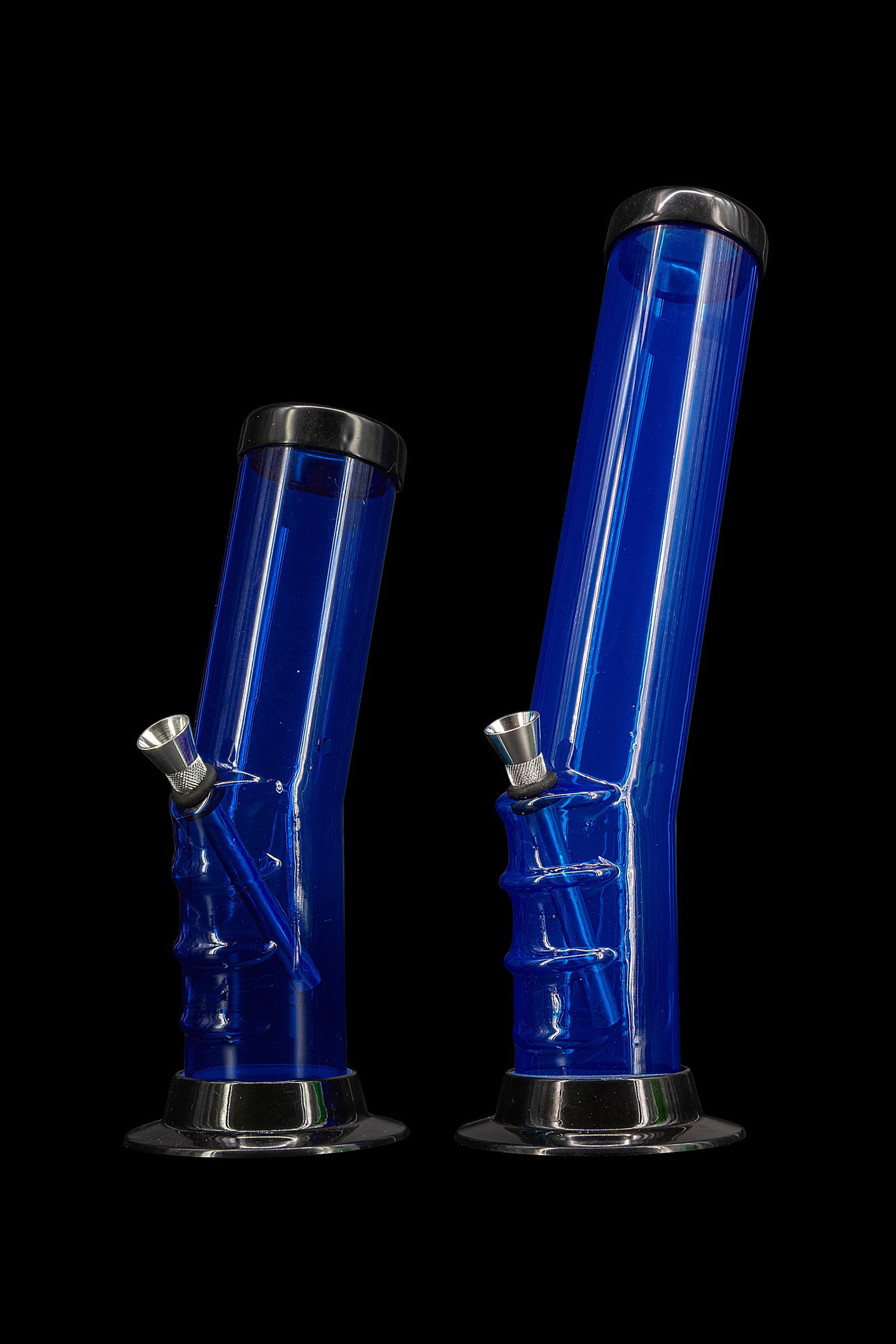 Blue glass water pipes for smoking cannabis, studio shot.