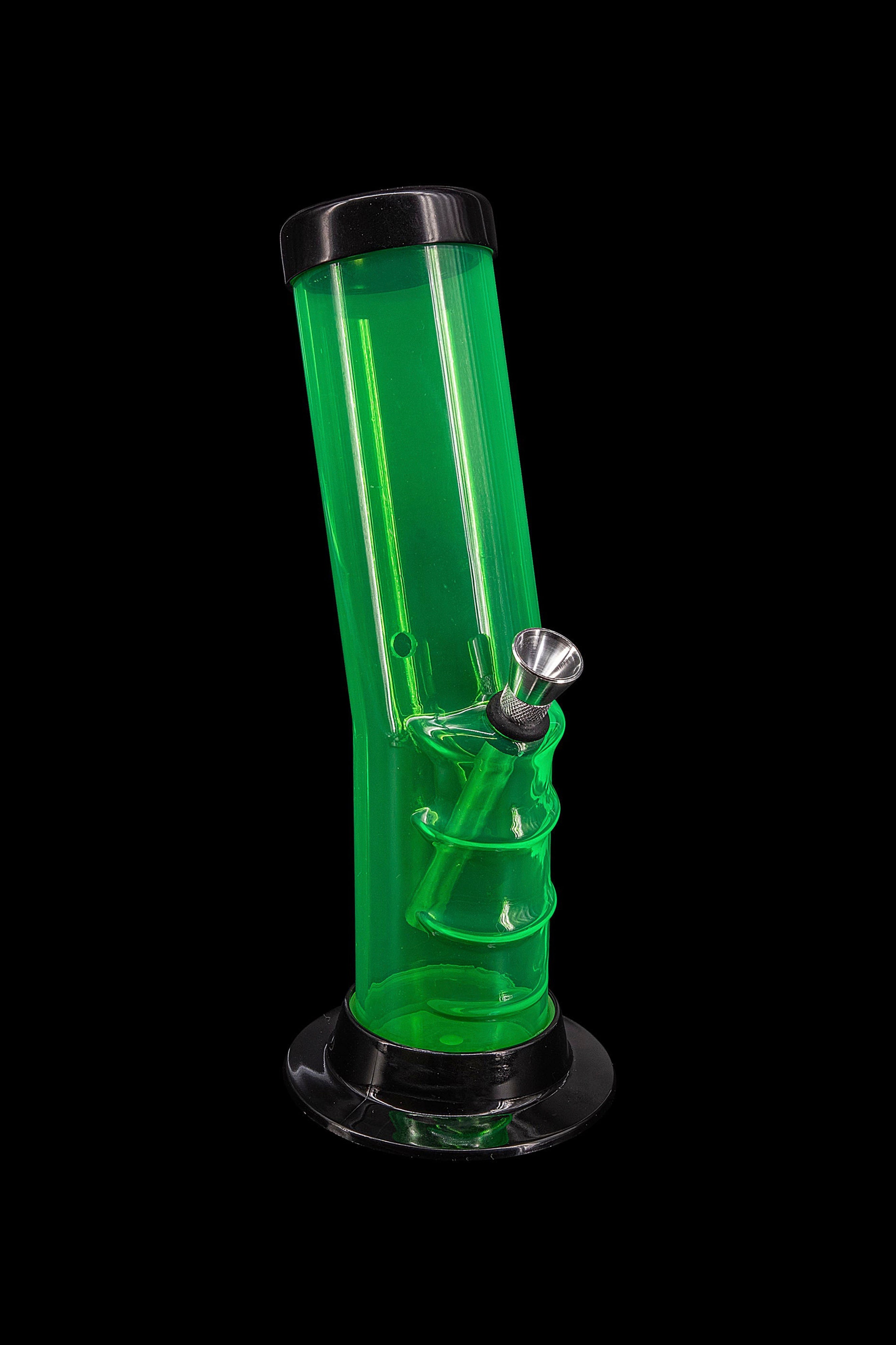 Green glass bong with percolator, isolated on black.