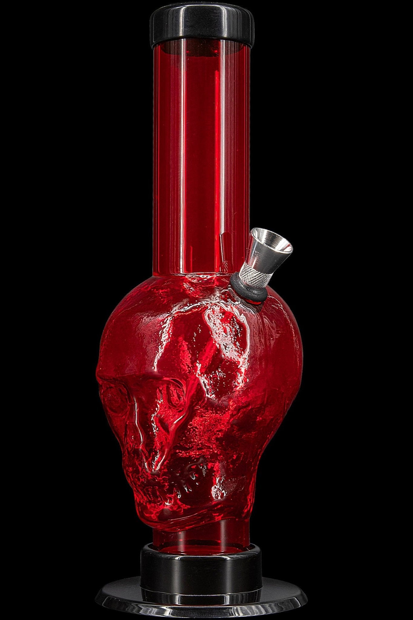 Red glass water pipe with skull design against a black background.