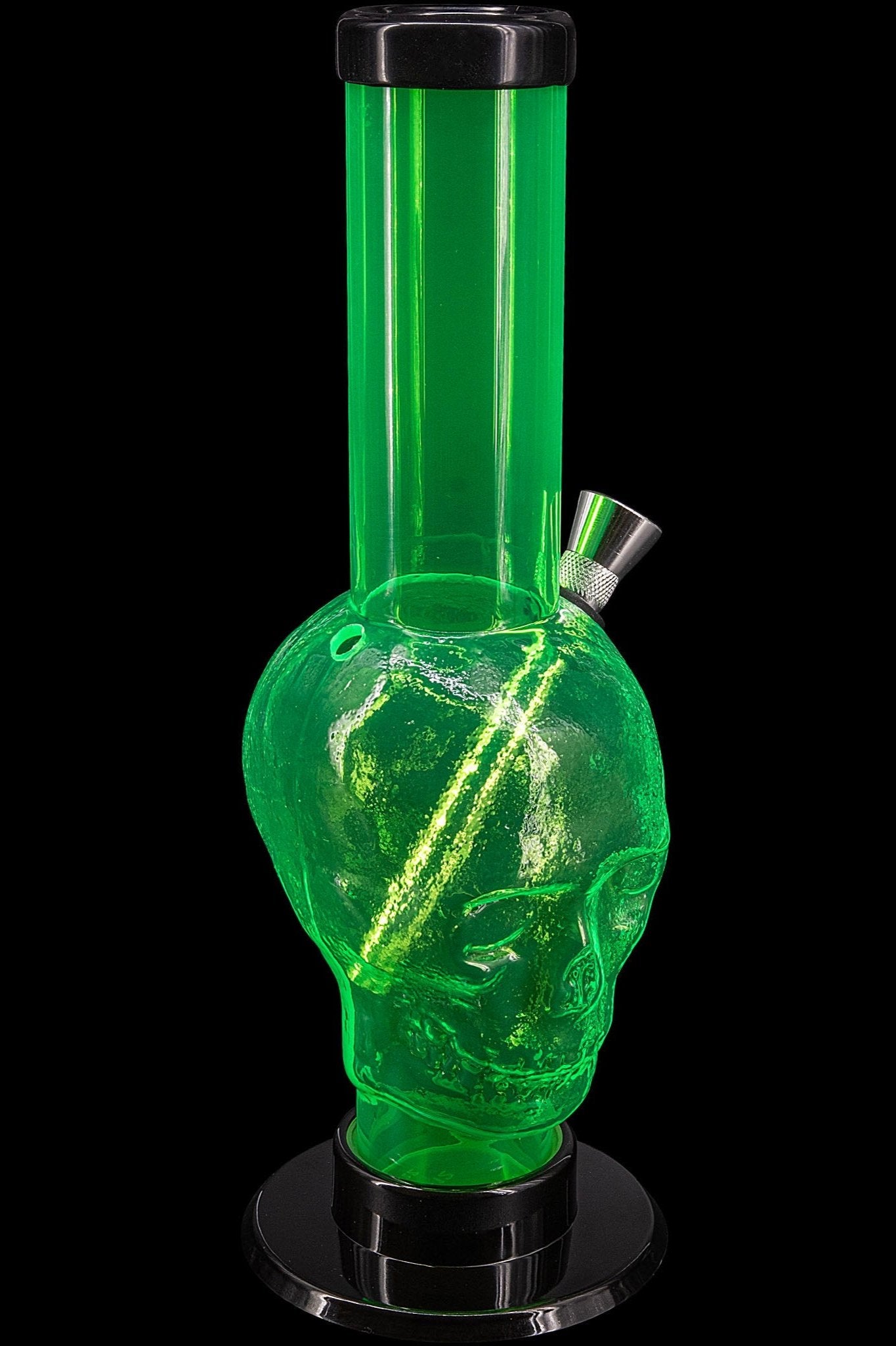 Green skull-shaped acrylic water pipe with bubbling water visible inside, set against a black background.