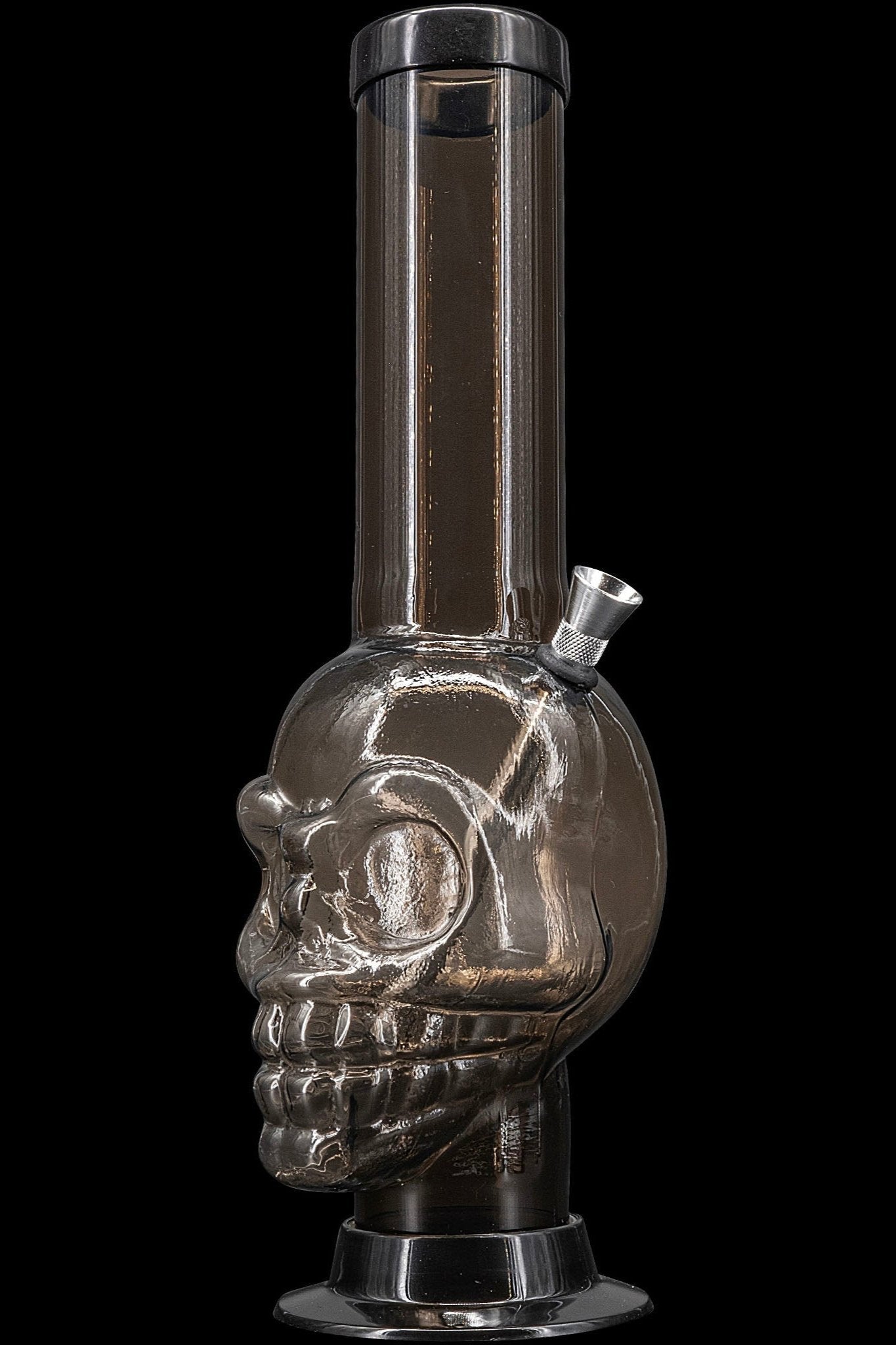 Black glass skull-shaped water pipe (bong) for cannabis use.