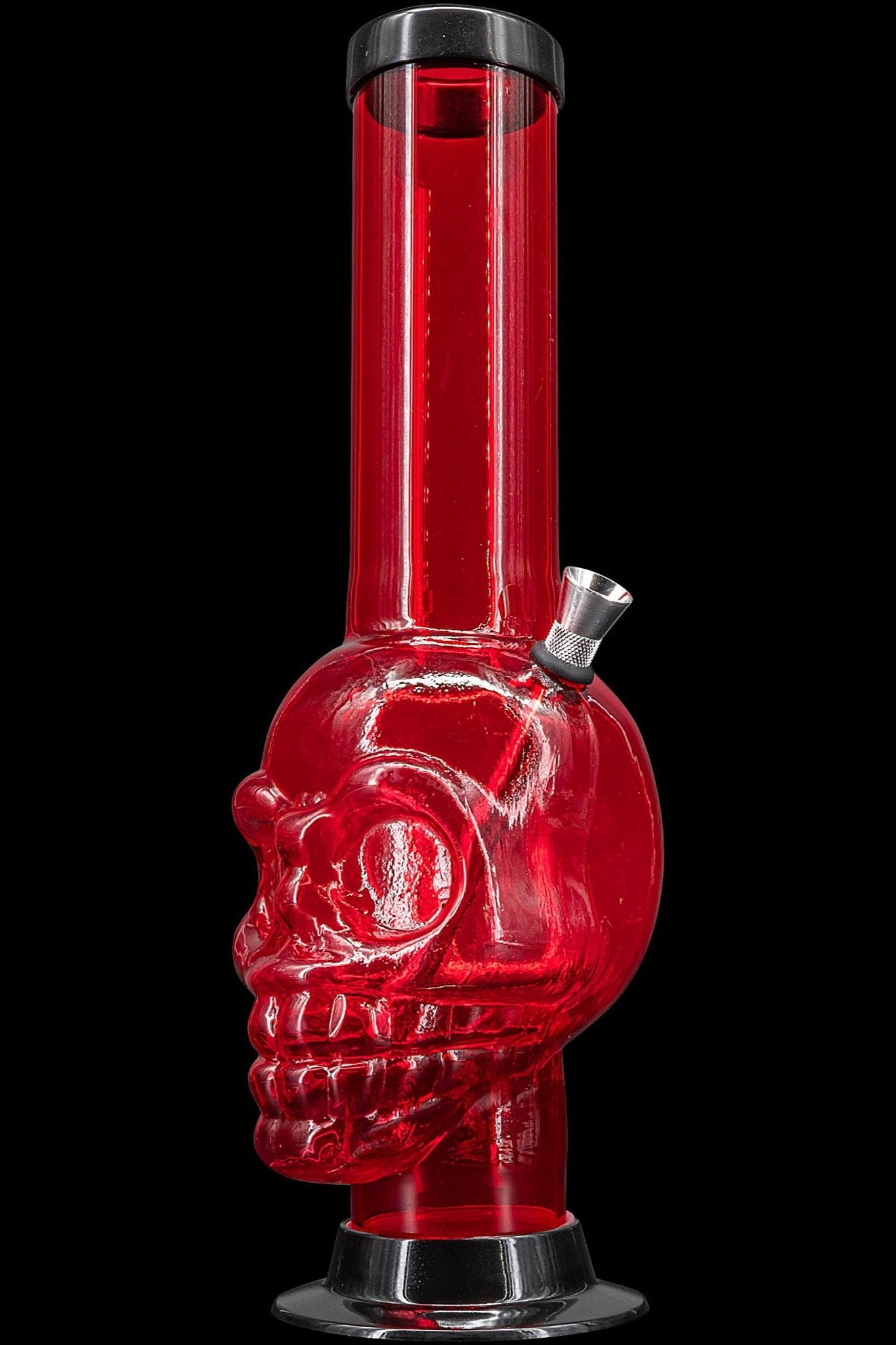Red glass water pipe shaped like a skull against a black background.