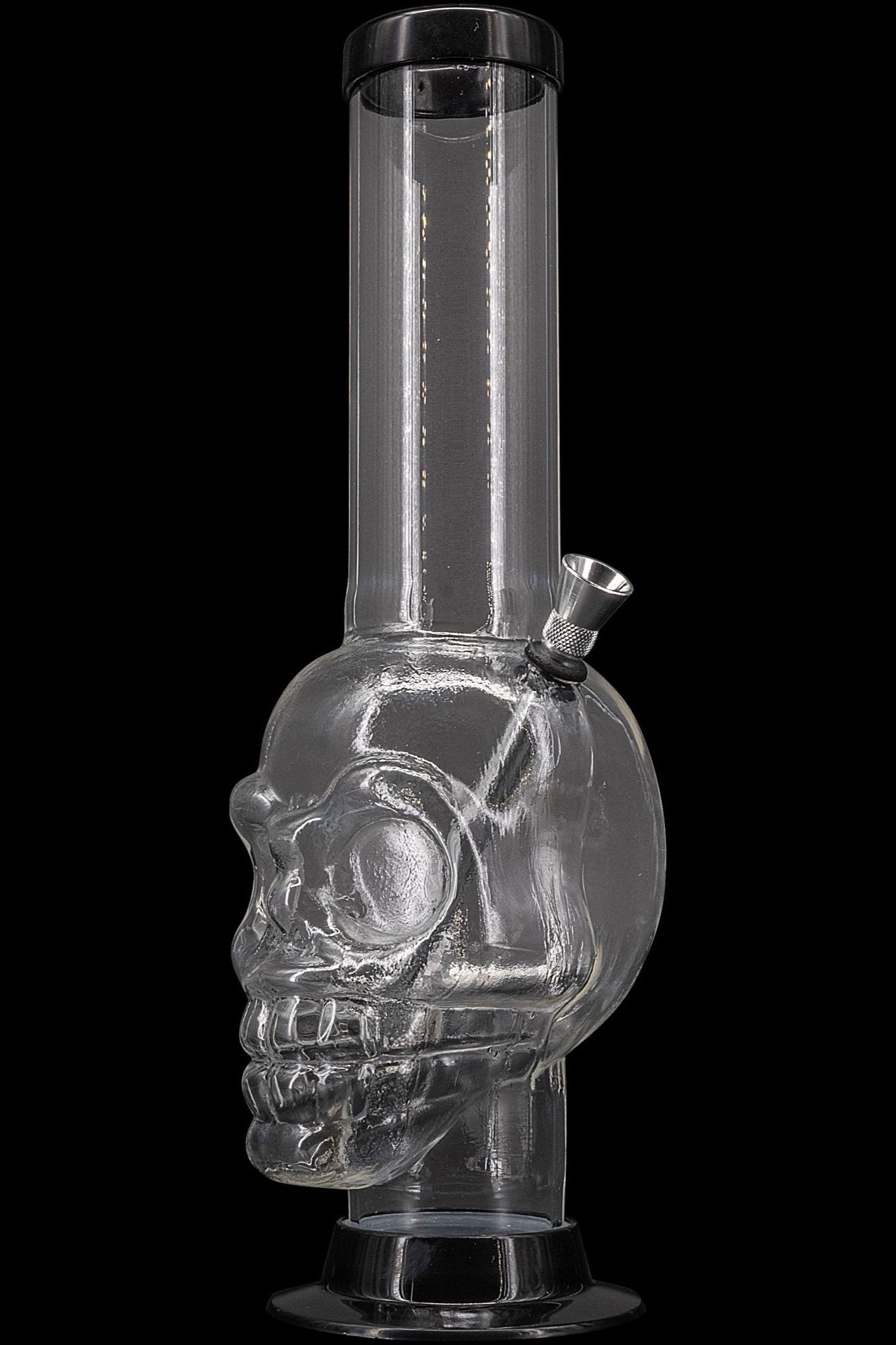 Clear glass water pipe shaped like a skull, with a metallic bowl piece.