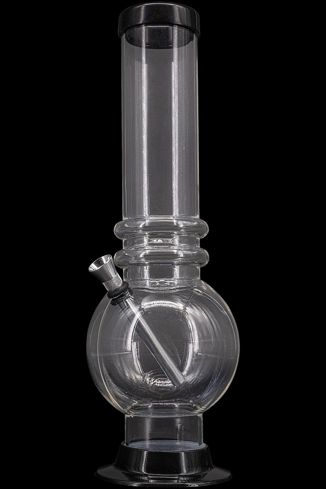 Clear glass water pipe (bong) with a rounded base and cylindrical neck, isolated on a black background.