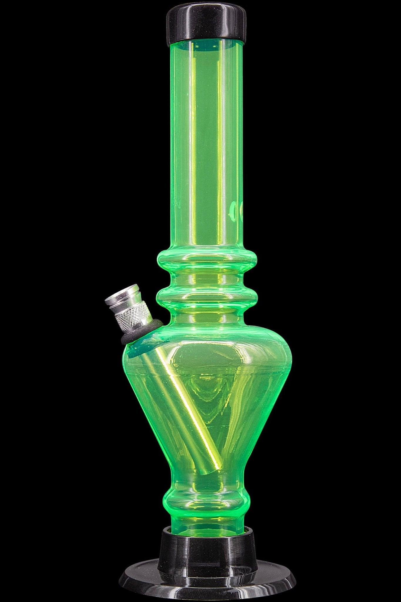 Green glass water pipe (bong) with a metallic mouthpiece and base, isolated on a black background.