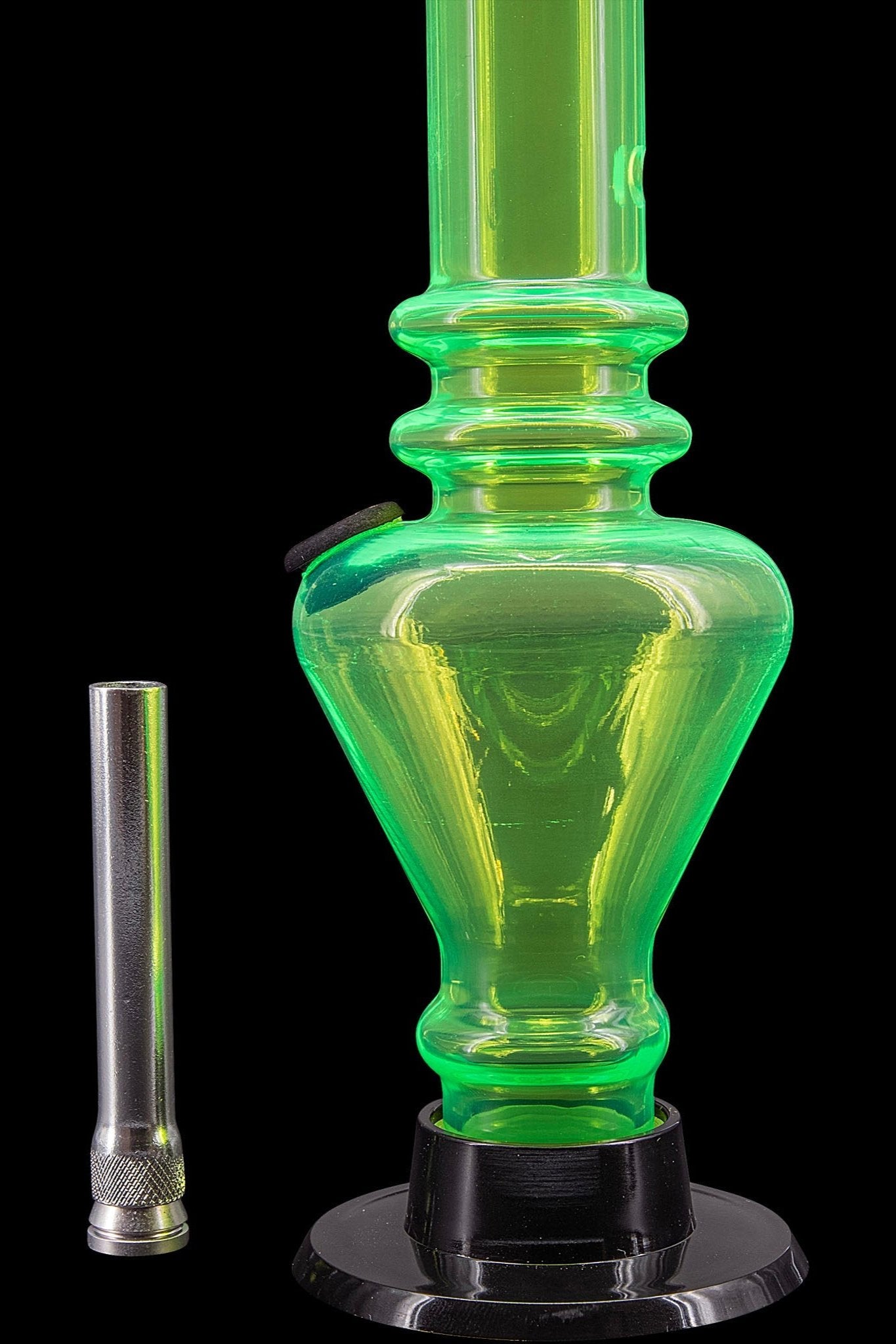 Green glass water pipe (bong) with metallic downstem, isolated on black.