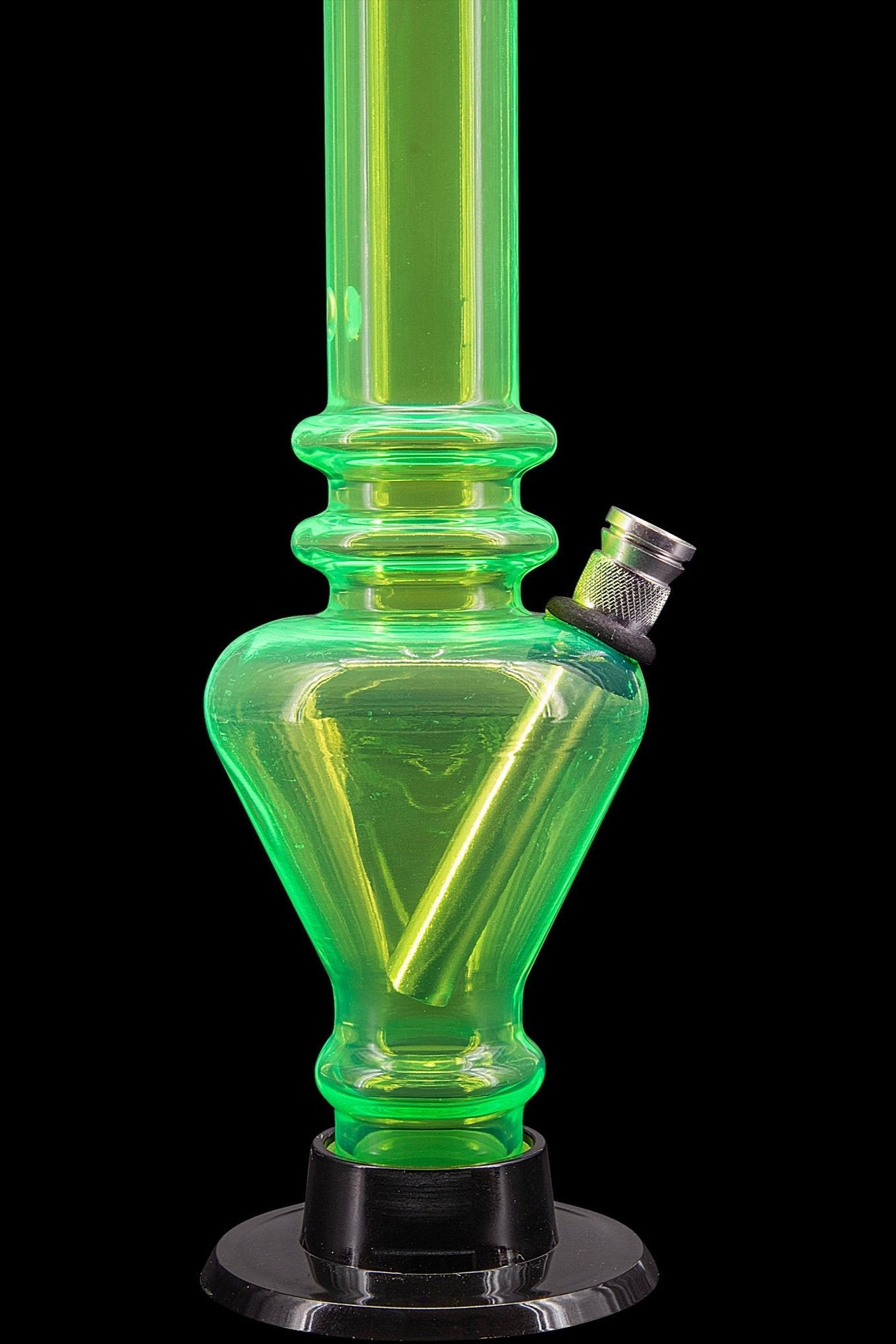 Green glass water pipe (bong) with black base, studio shot.
