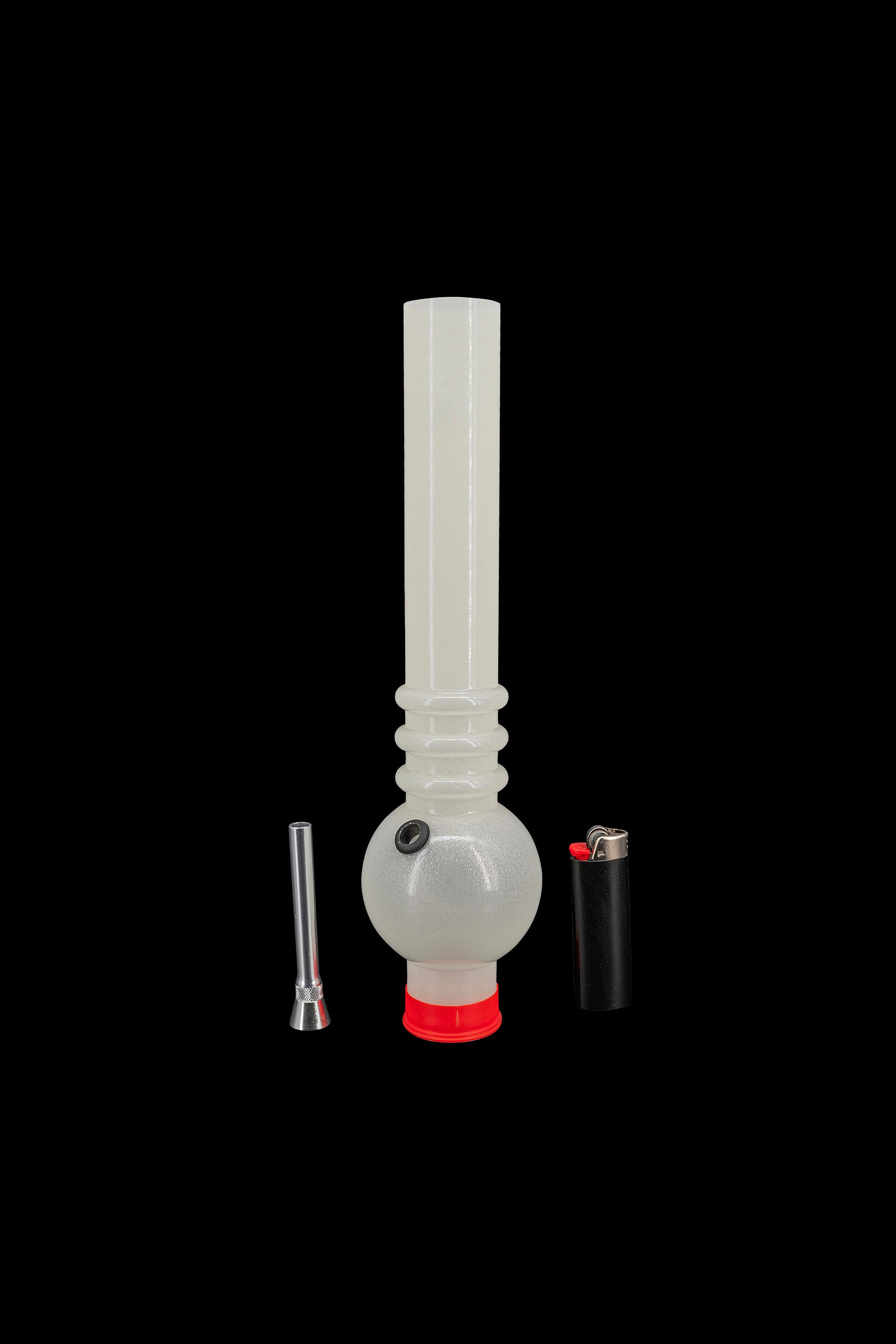 Glass bong with detachable downstem and lighter on black background.