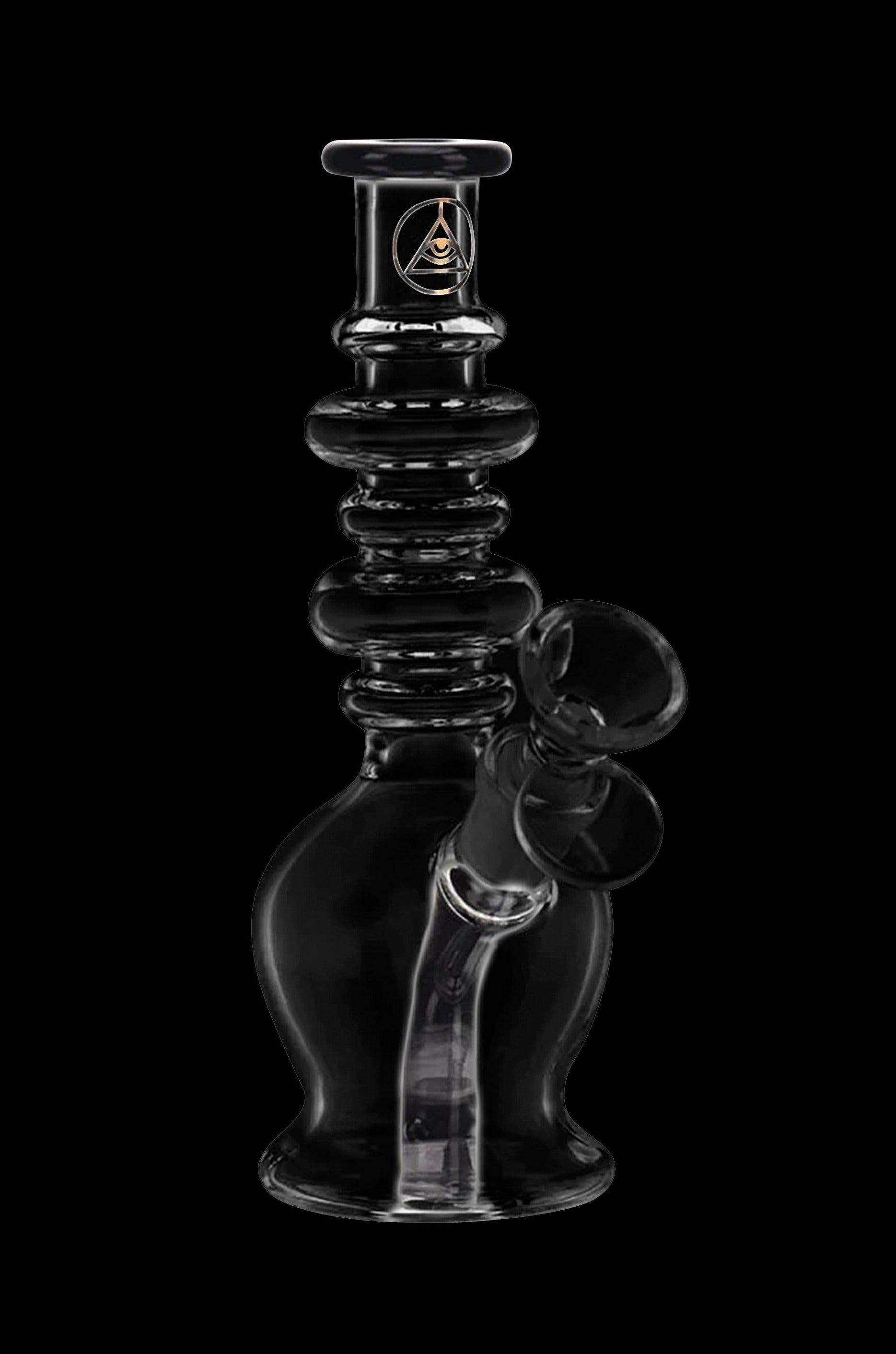 Clear glass water pipe (rig) with intricate design and bubbler, isolated on a black background.