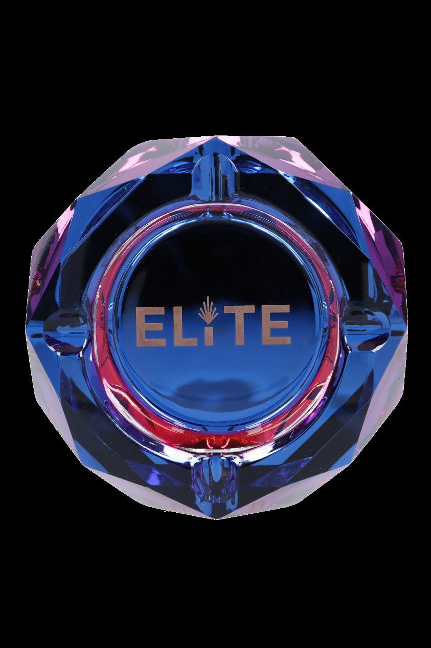 Blue glass ashtray with gold “Elite” lettering and cannabis leaf detail.