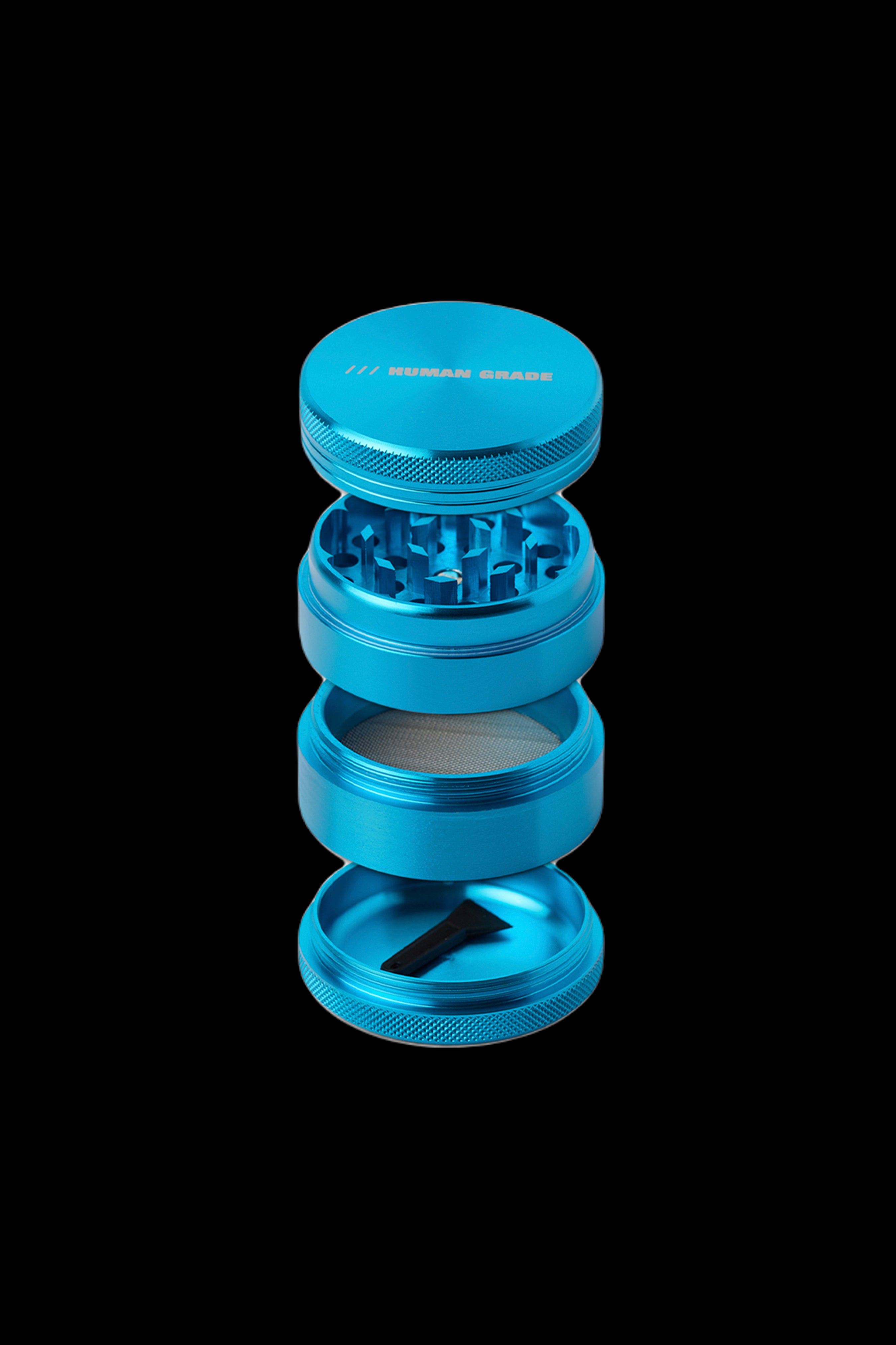 Blue four-piece cannabis grinder against a black background.