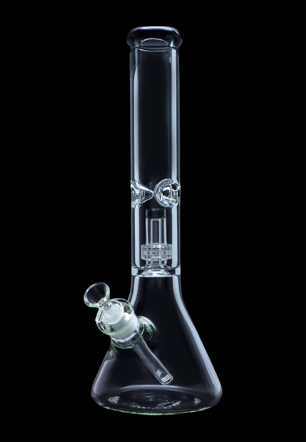 Clear glass bong with intricate perc filtration system, isolated on black.