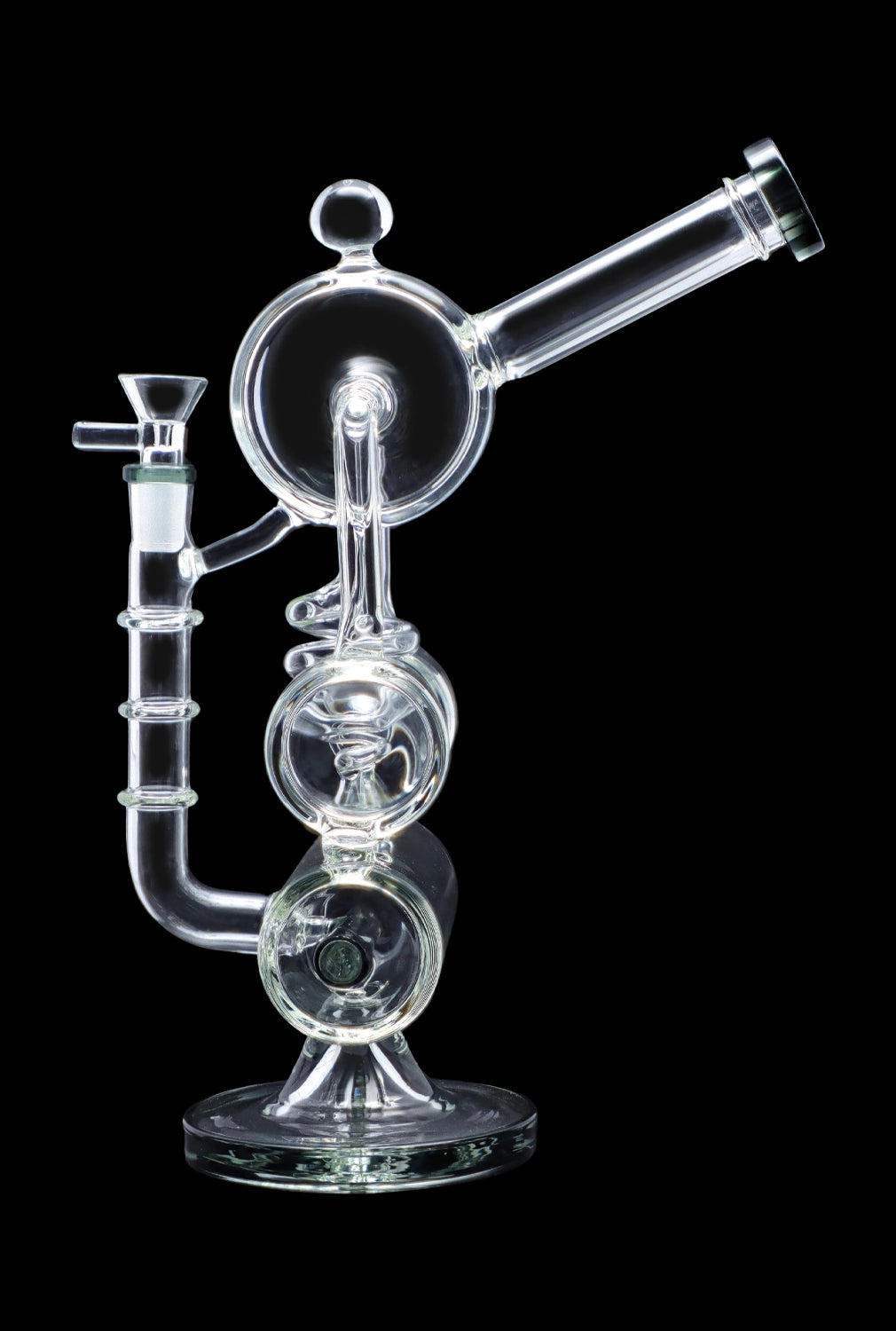 Clear glass water pipe (rig) with intricate bubblers and a bowl, isolated on black.