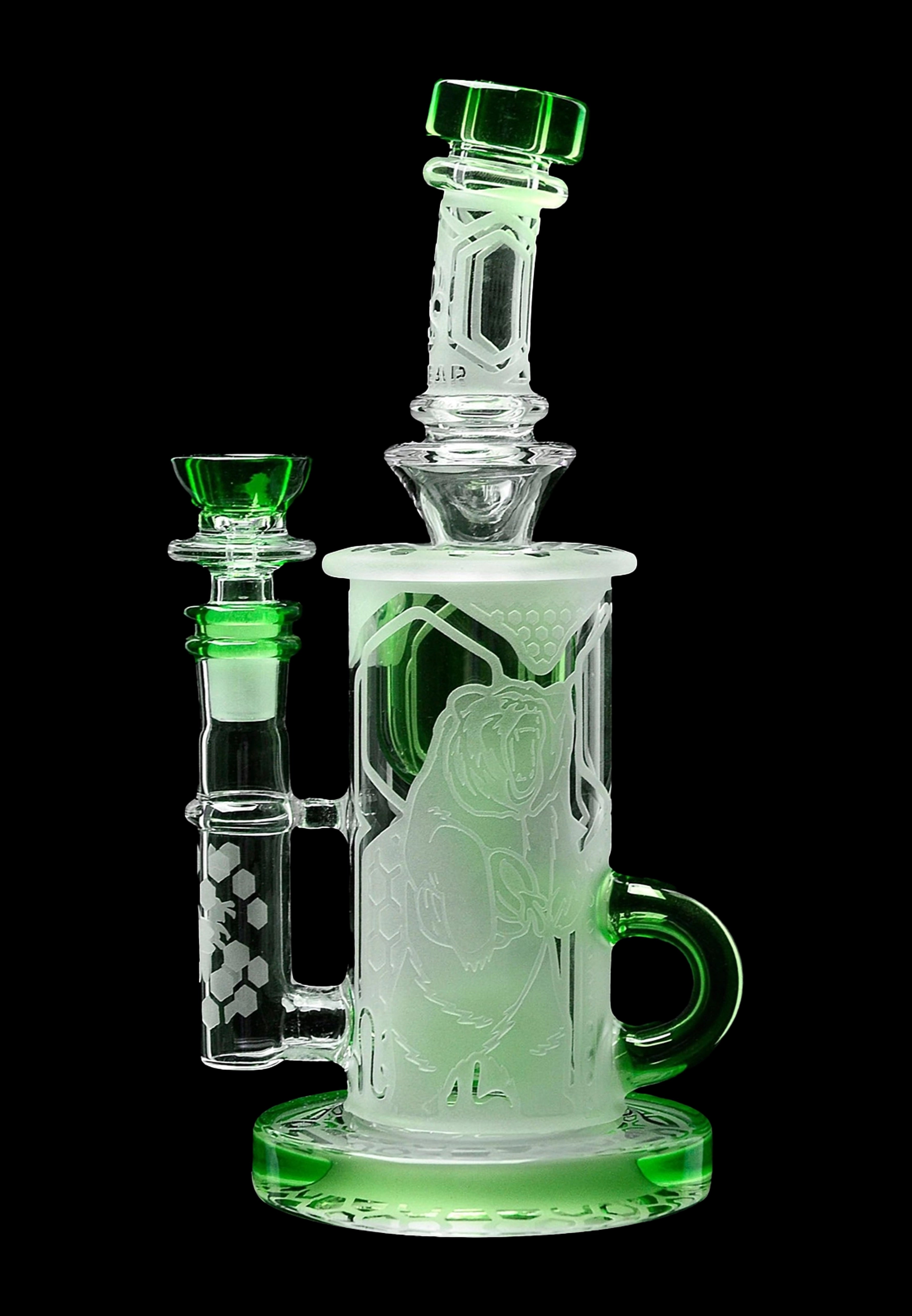 Glowing green glass water pipe (rig) with intricate sculpted designs.