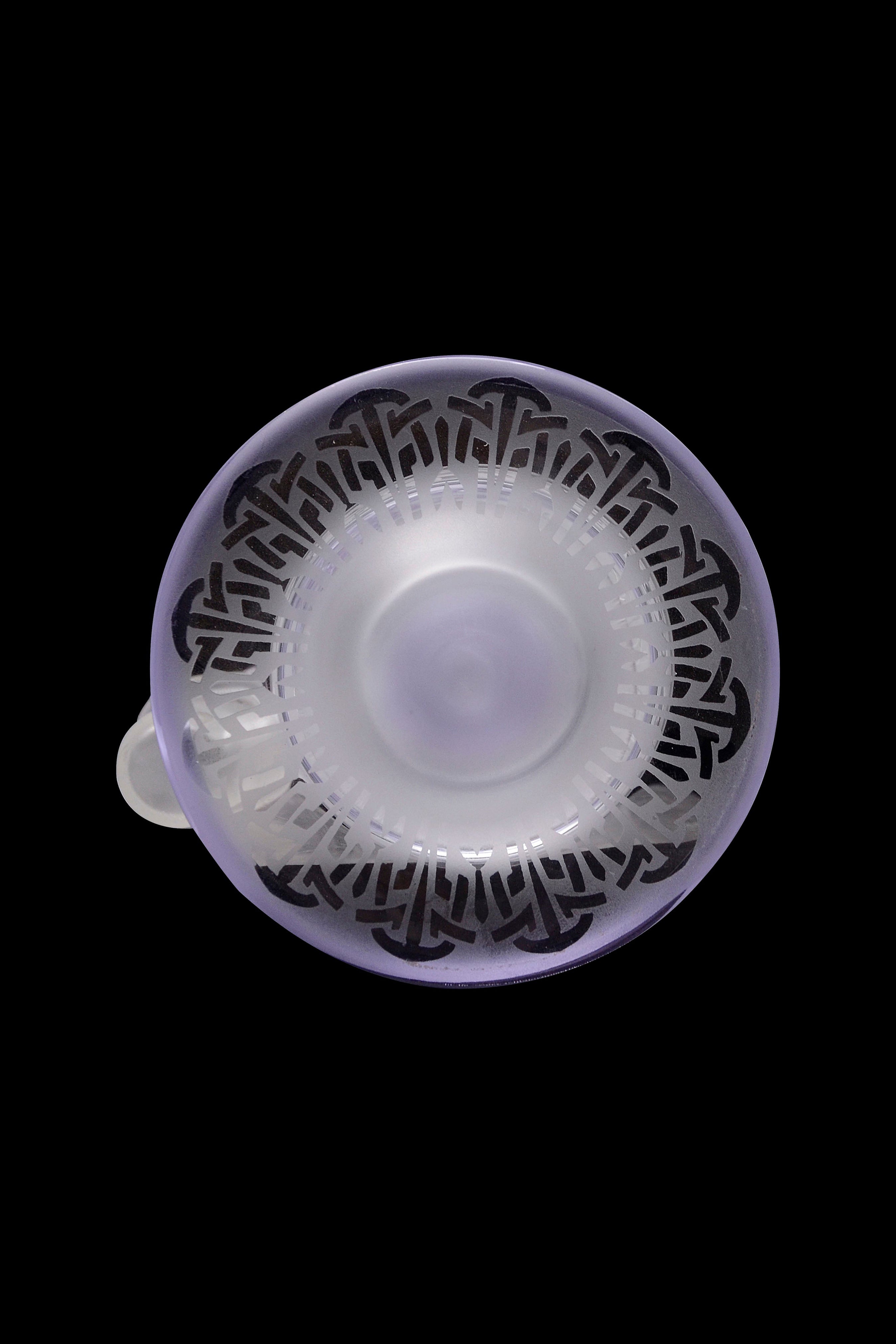 Lavender glass pipe with intricate mushroom designs.