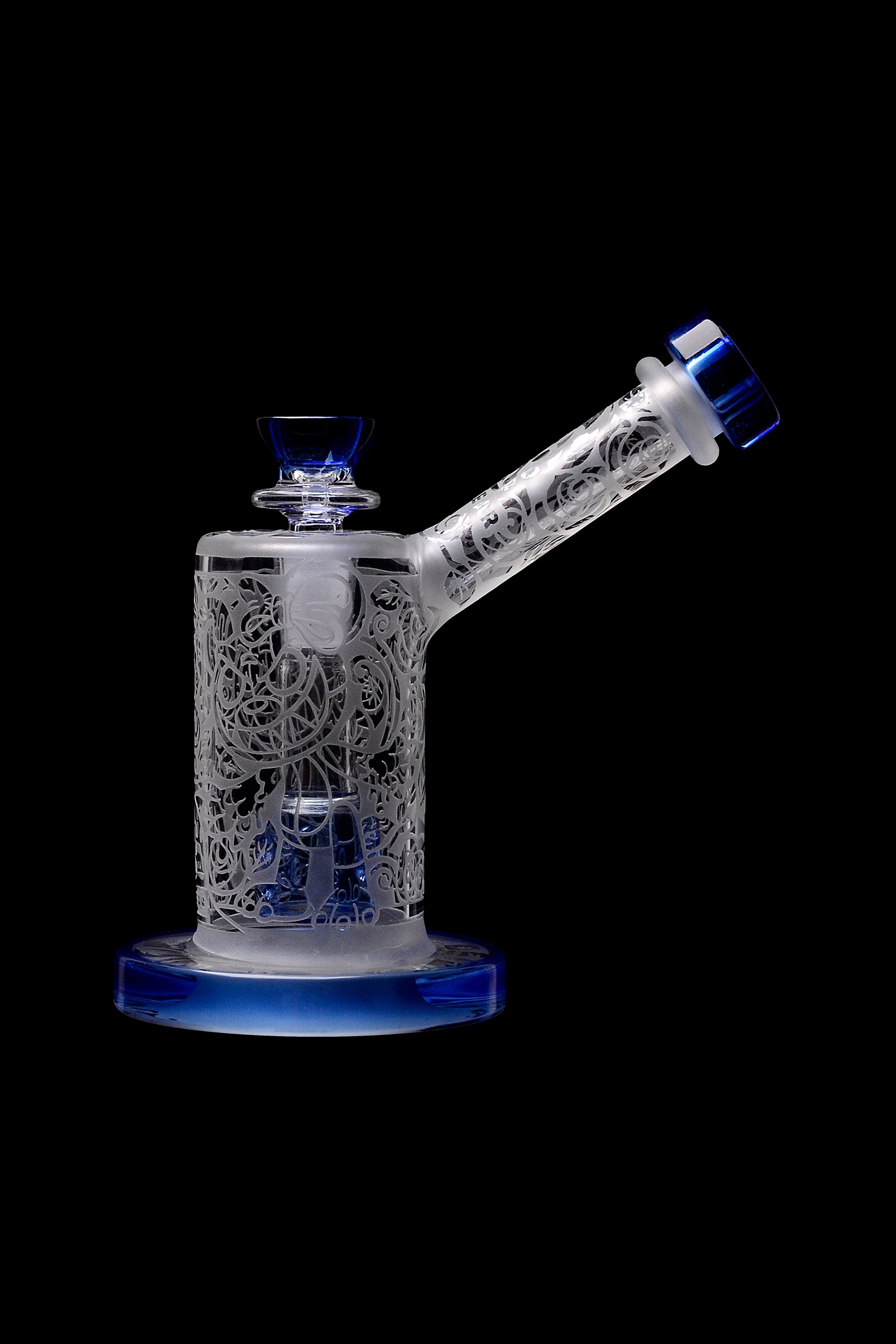 Intricate glass water pipe with blue accents, isolated on a black background.