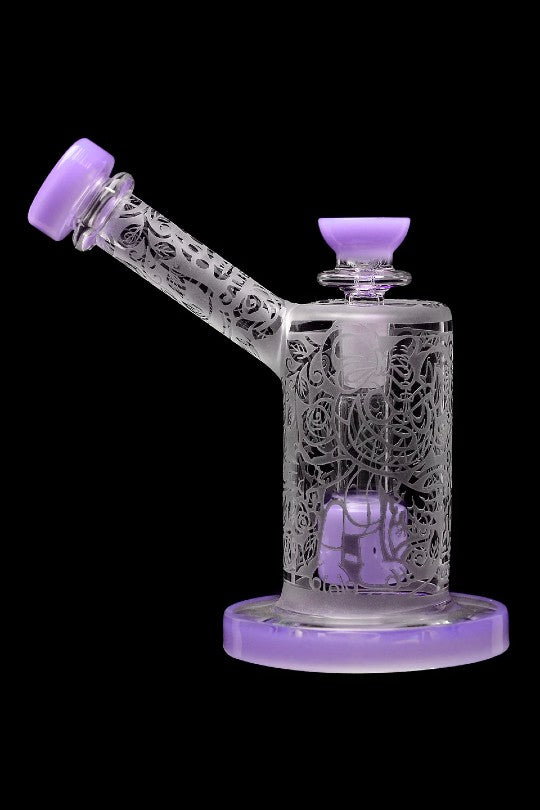 Intricately carved glass water pipe (rig) with lavender accents.
