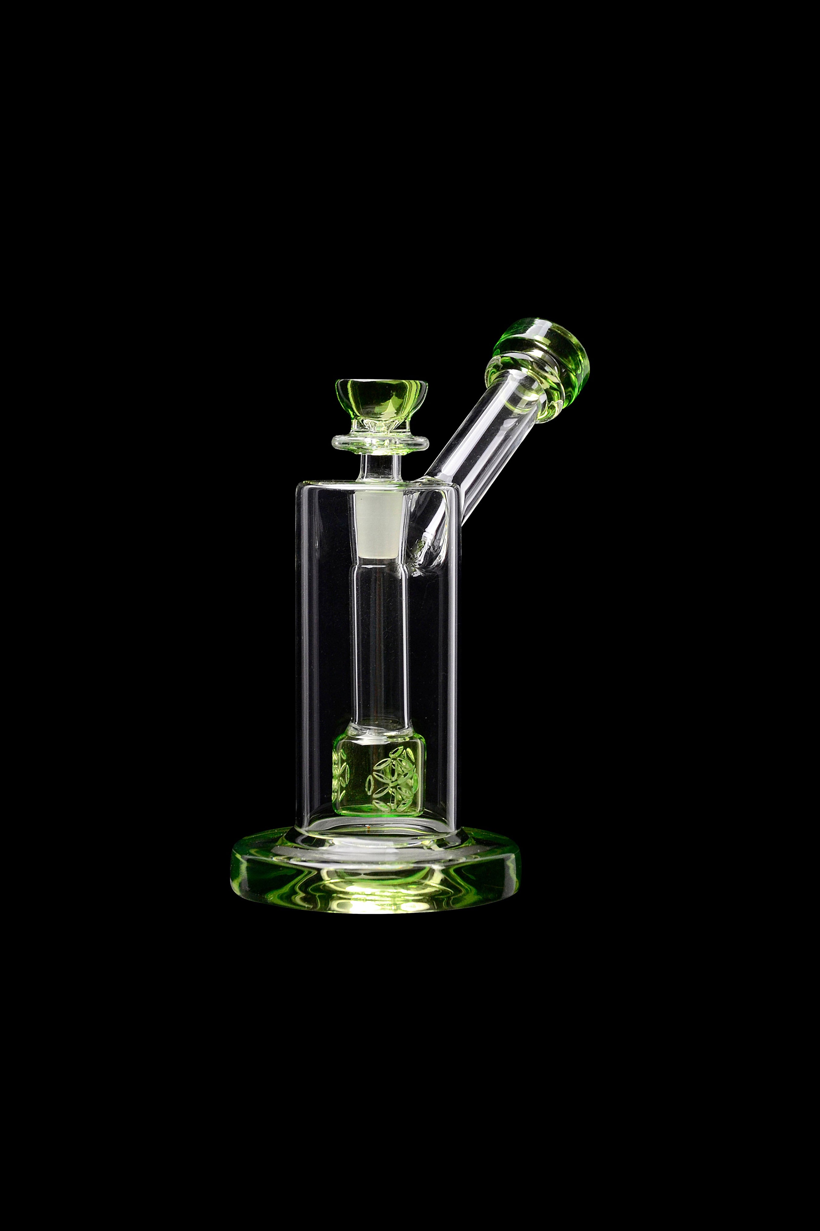 Green glass bubbler water pipe isolated on black.