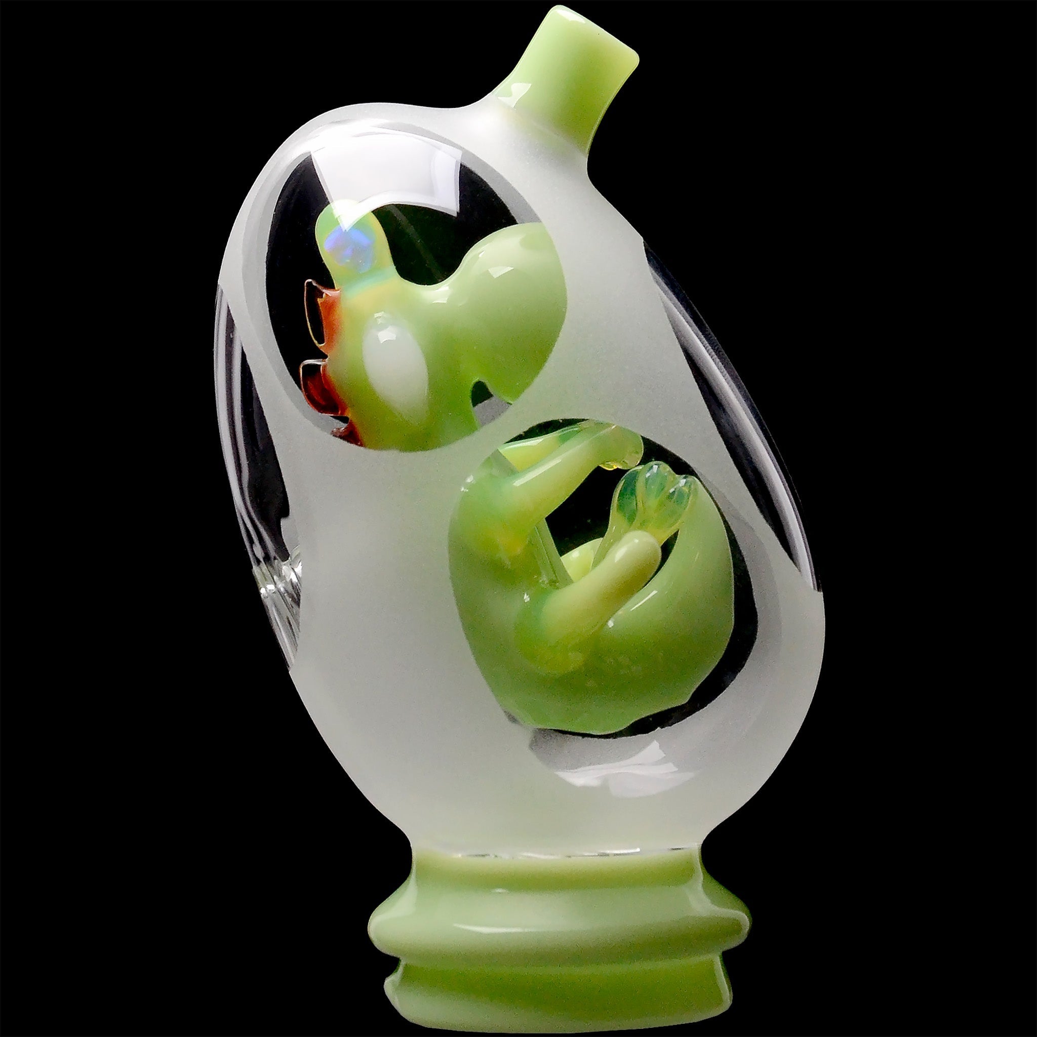 Close-up of the Lime Green Glassic Frosted Dino Egg Puffco Peak Glass Attachment showing a frosted egg window with a glossy green dino inside.