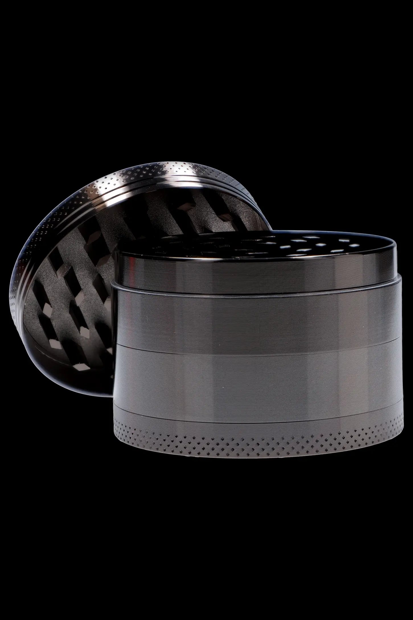 Metallic four-chamber cannabis grinder with open lid.