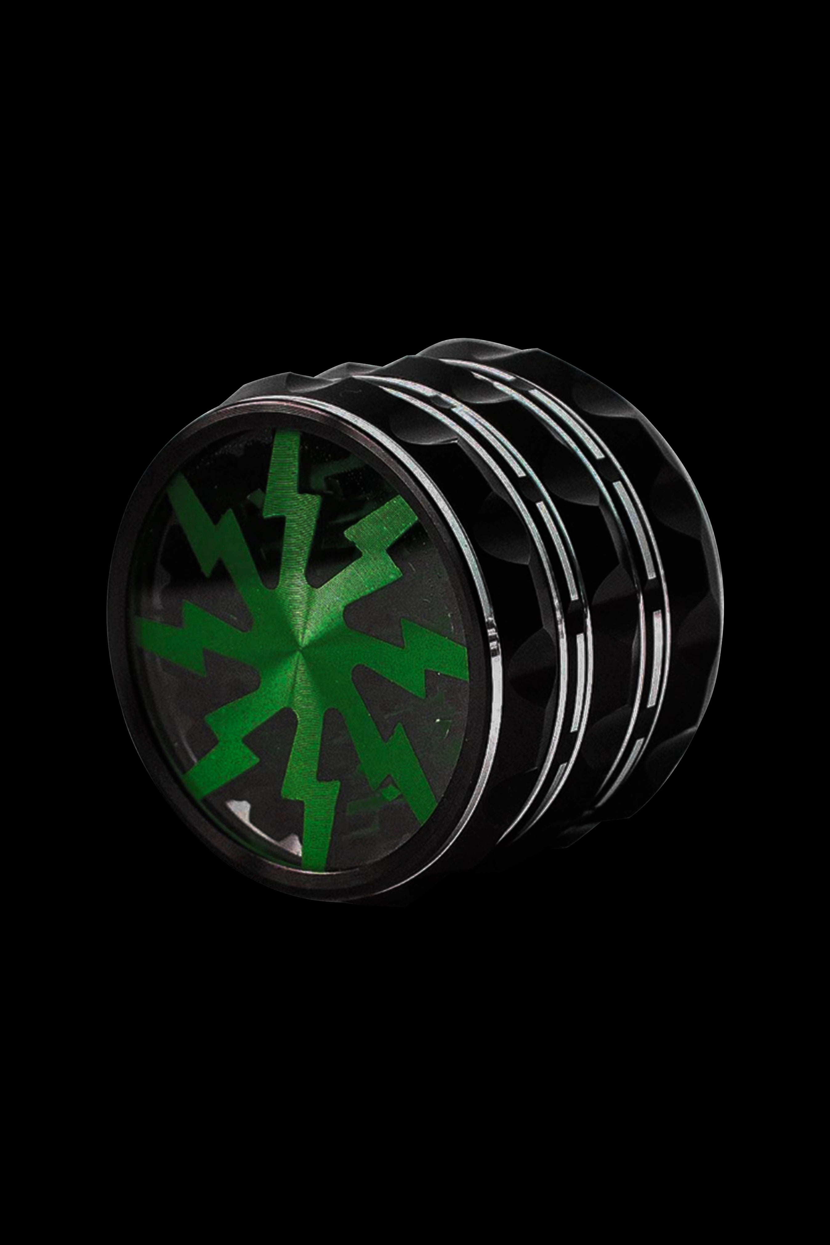 Metal cannabis grinder with a green cannabis leaf design.
