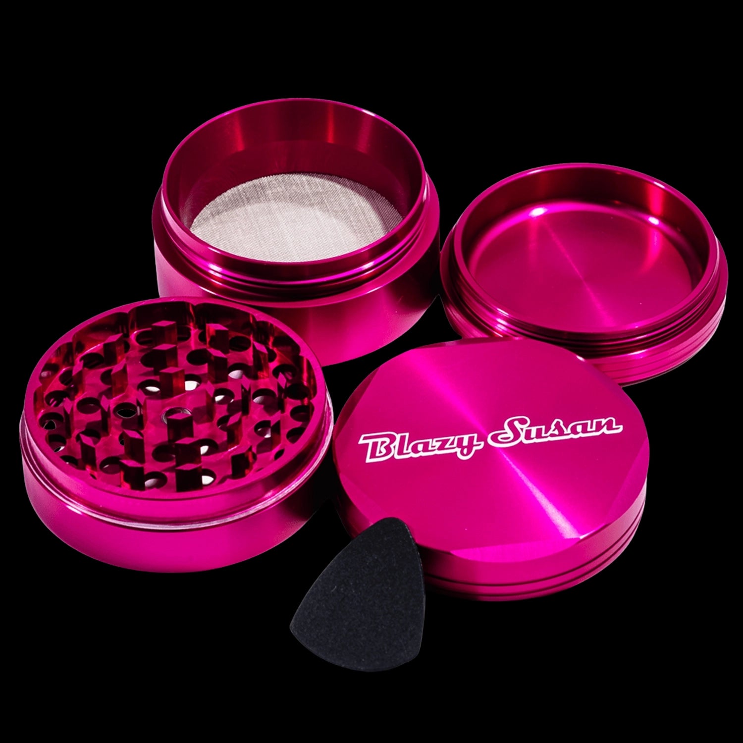Top-down view of a disassembled purple Blazy Susan 4-pc 3 Chamber Grinder showing its lid with logo, grinding plate, mesh chamber, and collection tray.