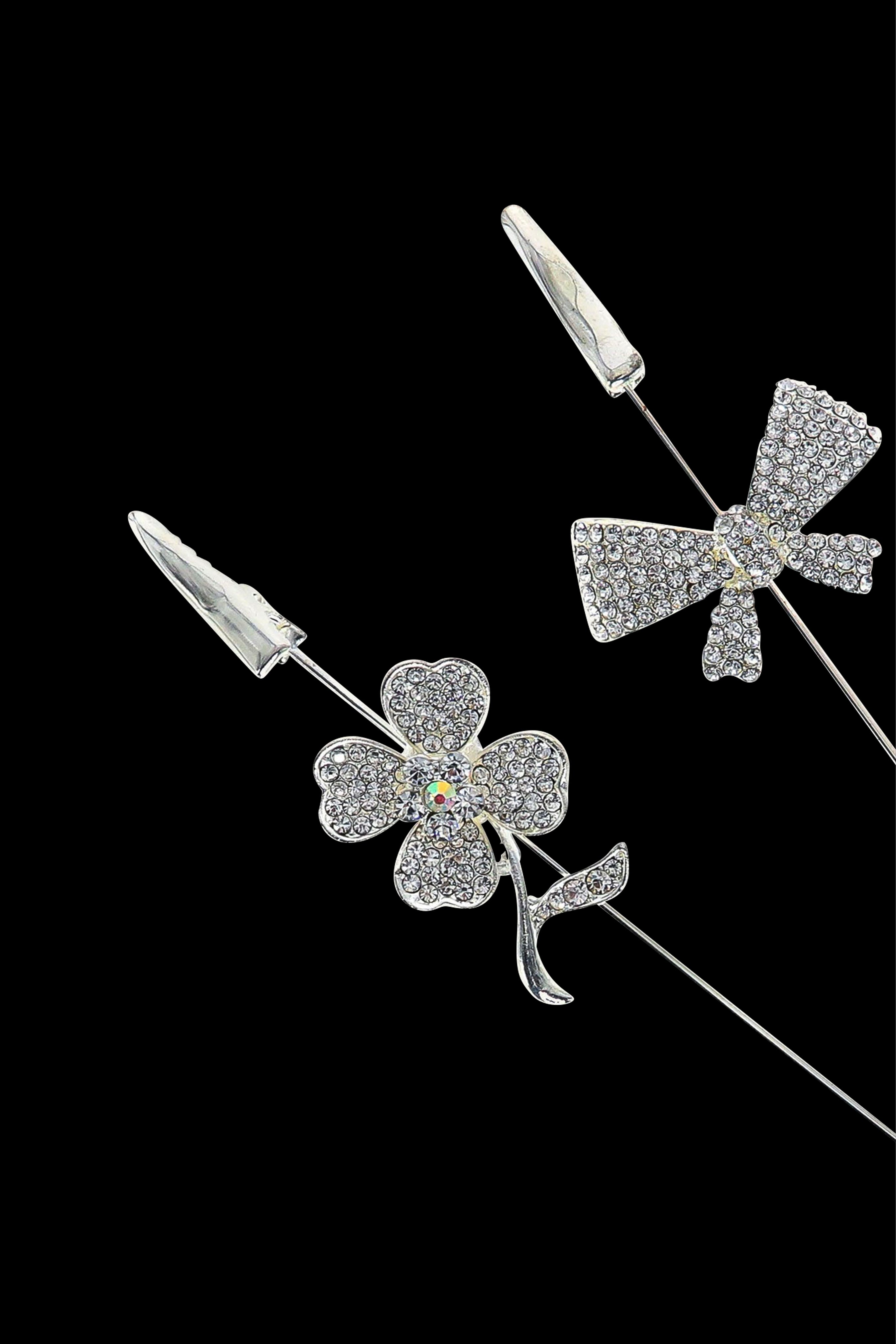 Diamond-encrusted cannabis flower and bud accessories against a black background.