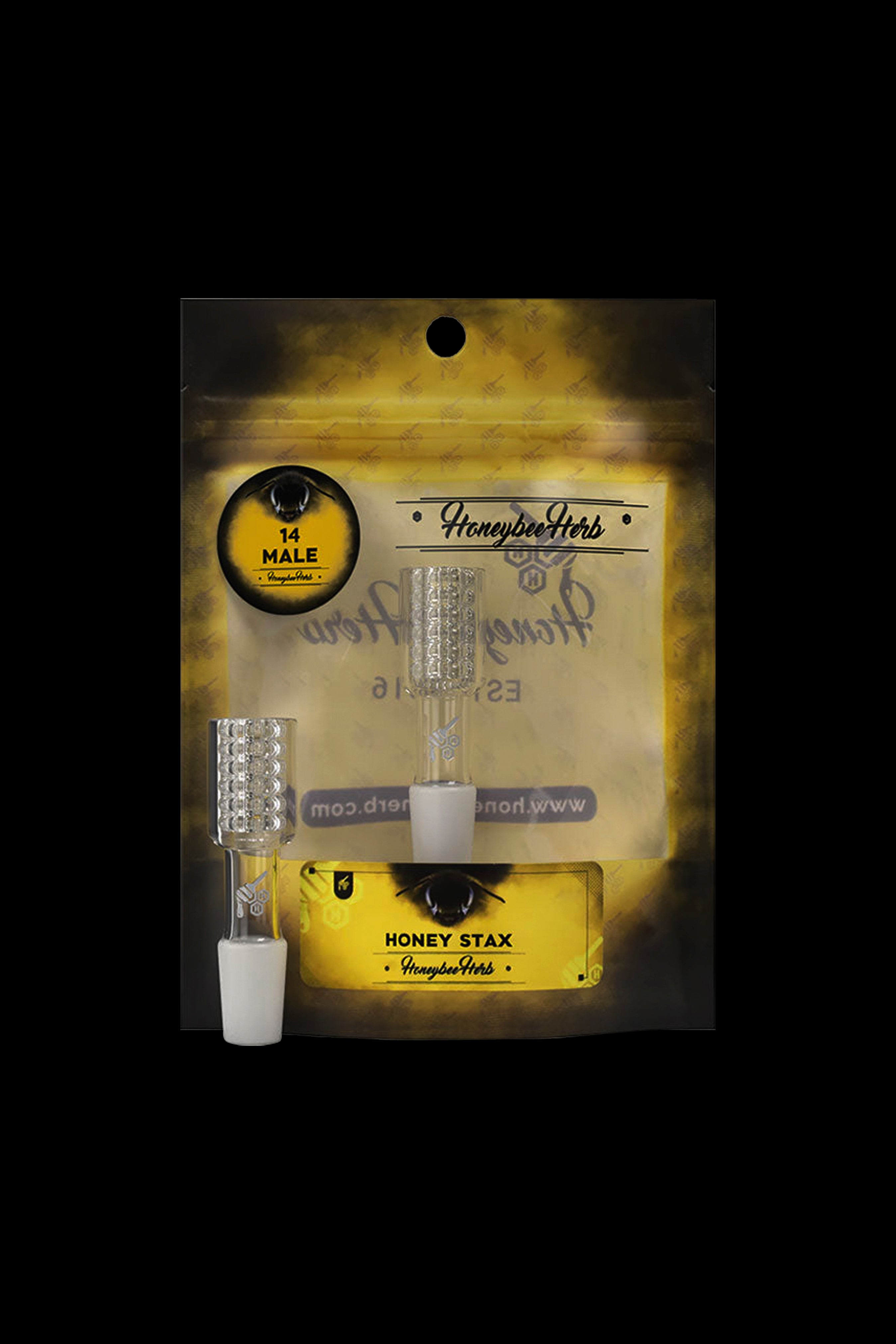 Packaged cannabis accessories including a dab tool, quartz banger, and glass tip, branded "Honeybee Herbs."