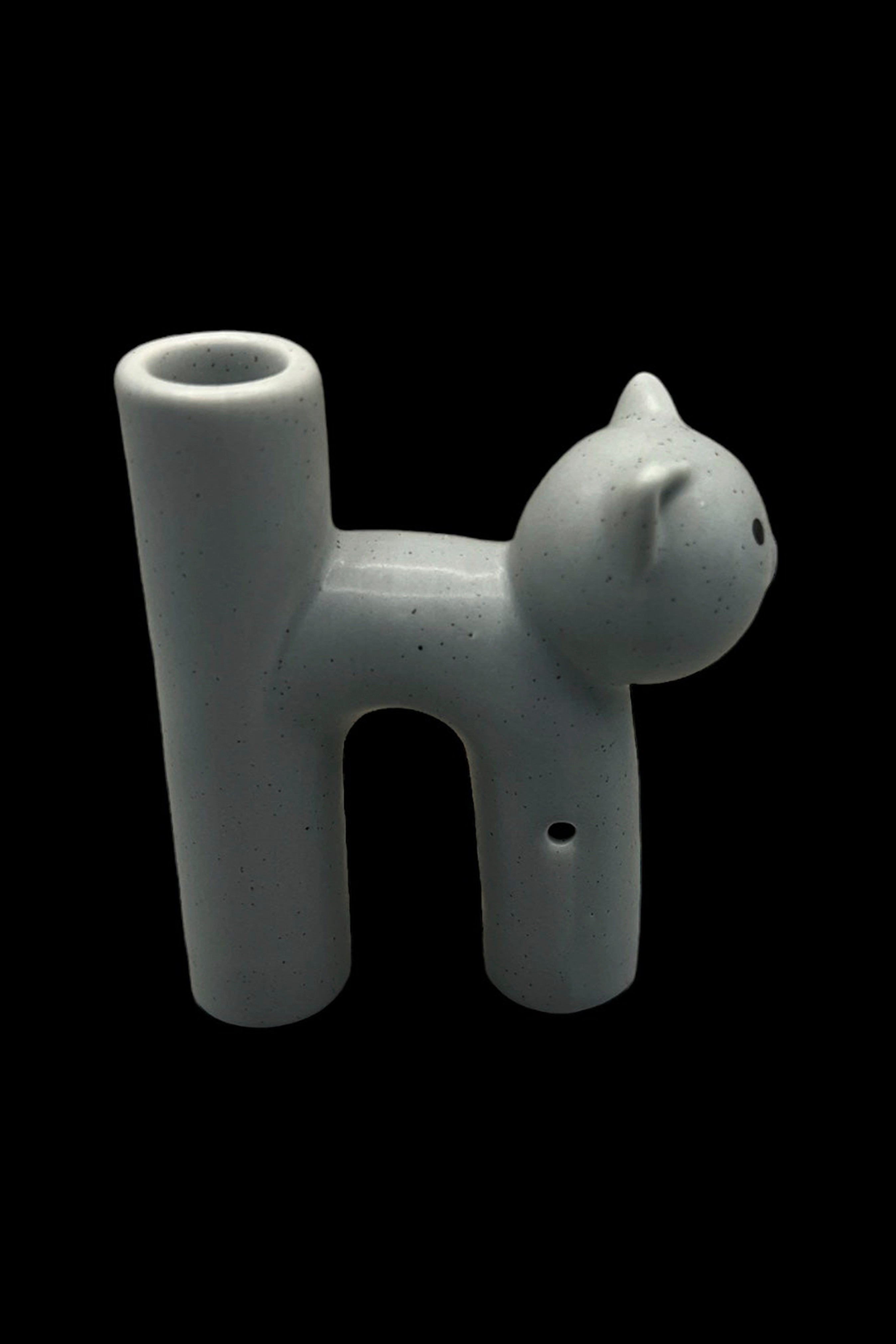 Ceramic pipe shaped like a cat's head.