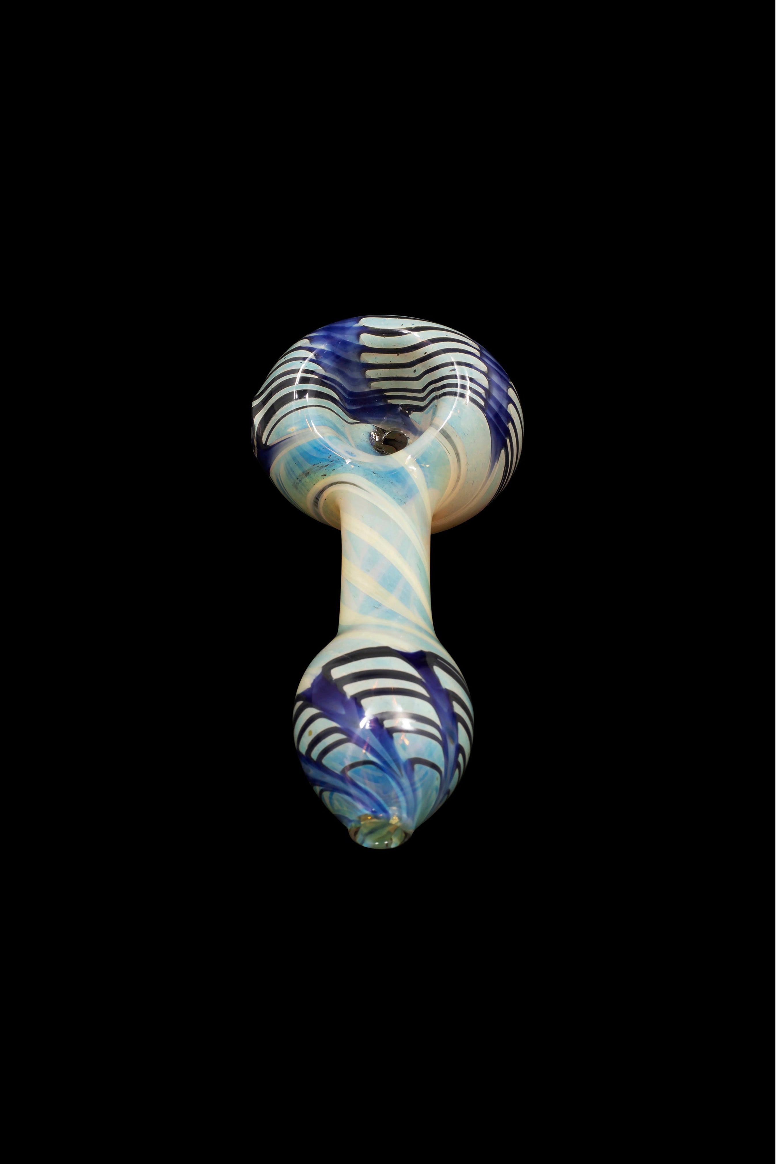 Hand-blown glass pipe with blue and white swirling patterns against a black background.