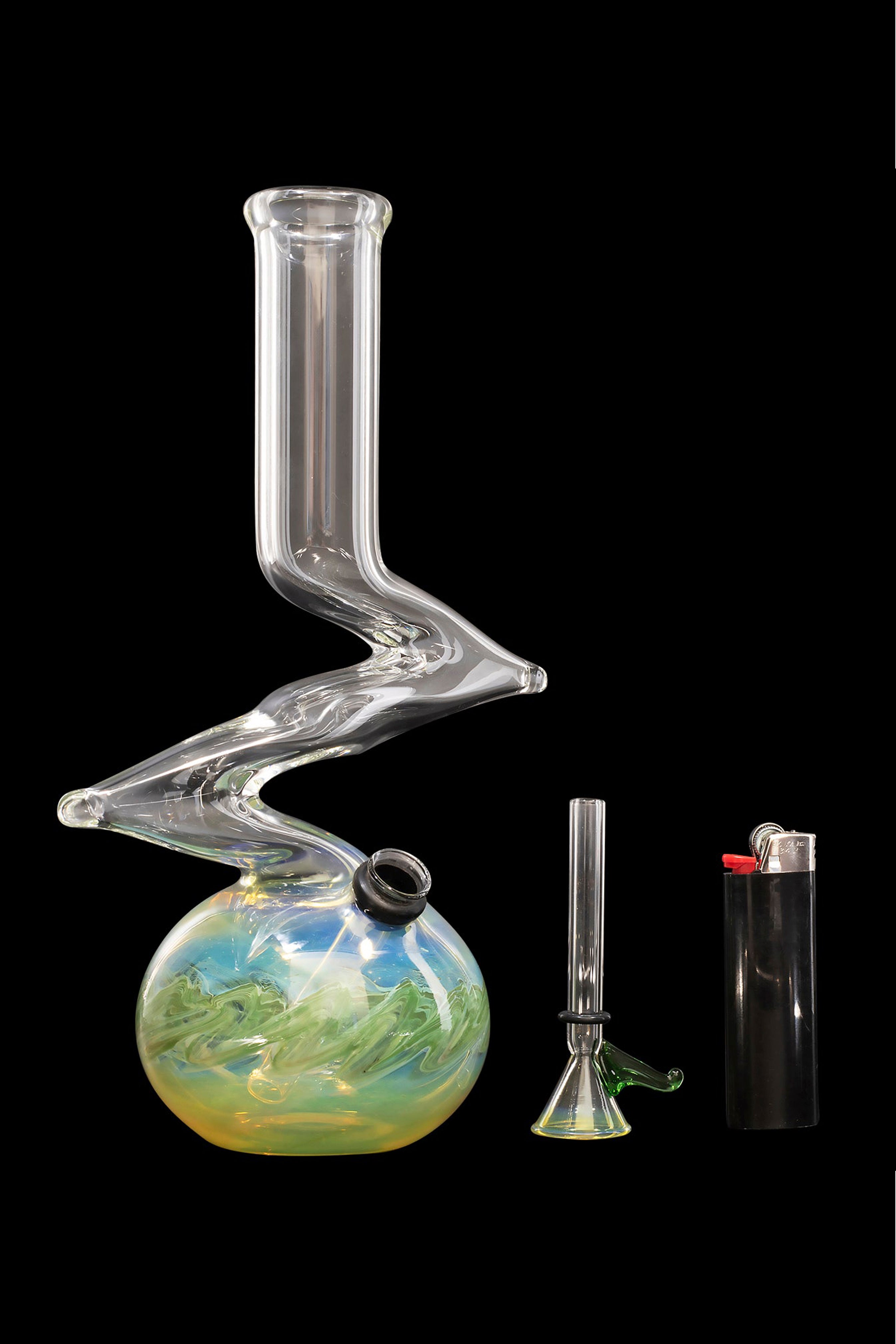 Glass bong with swirling blue and green base, alongside a glass pipe and lighter on a black background.