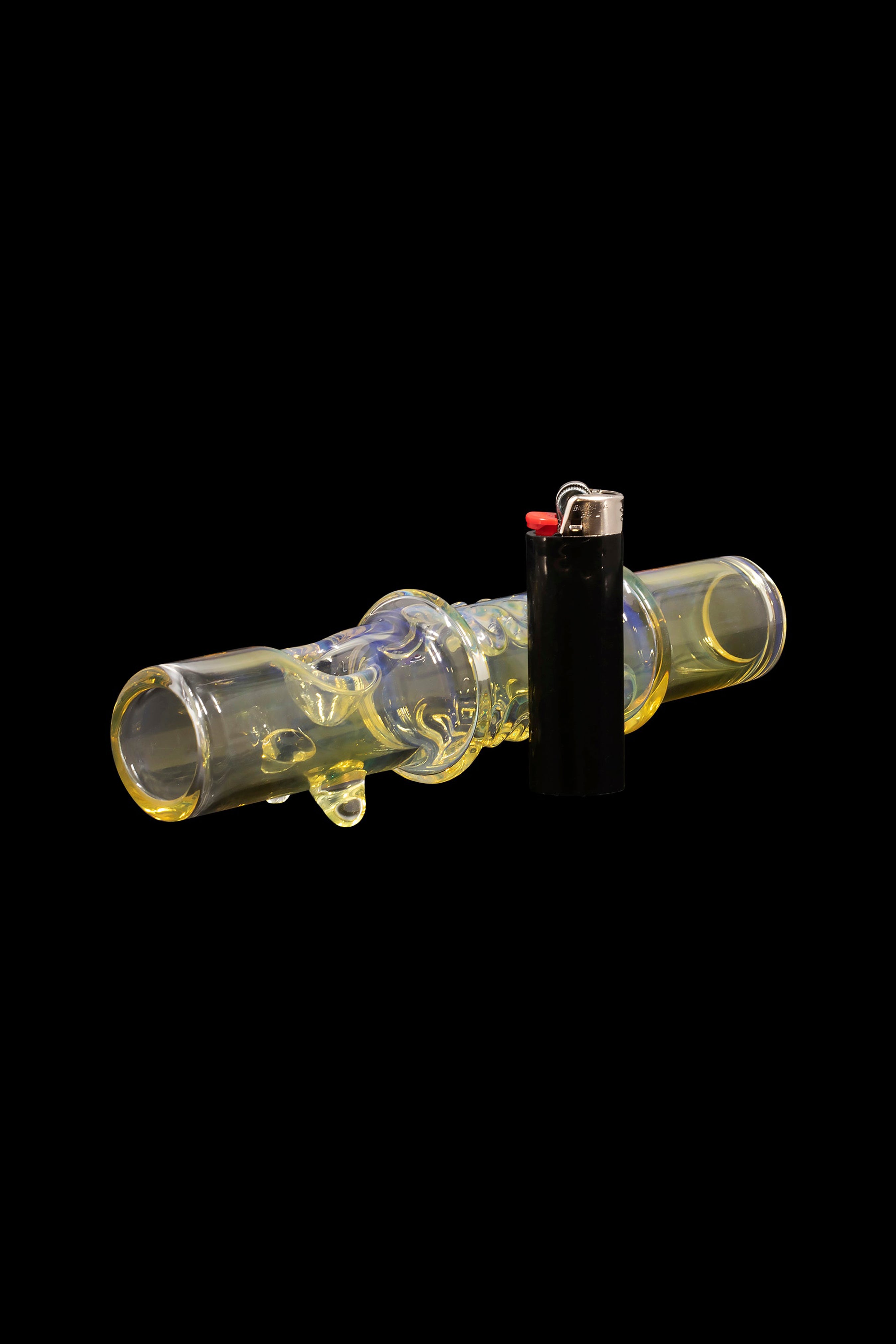Glass cannabis pipe and lighter on a black background.