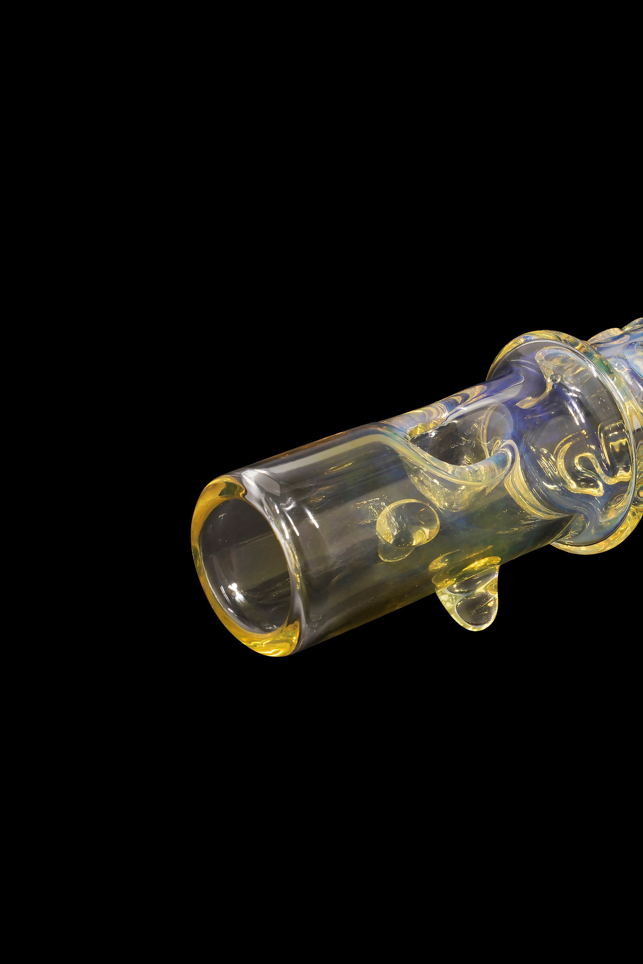 Glass cannabis oil burner pipe with colorful swirls against a black background.