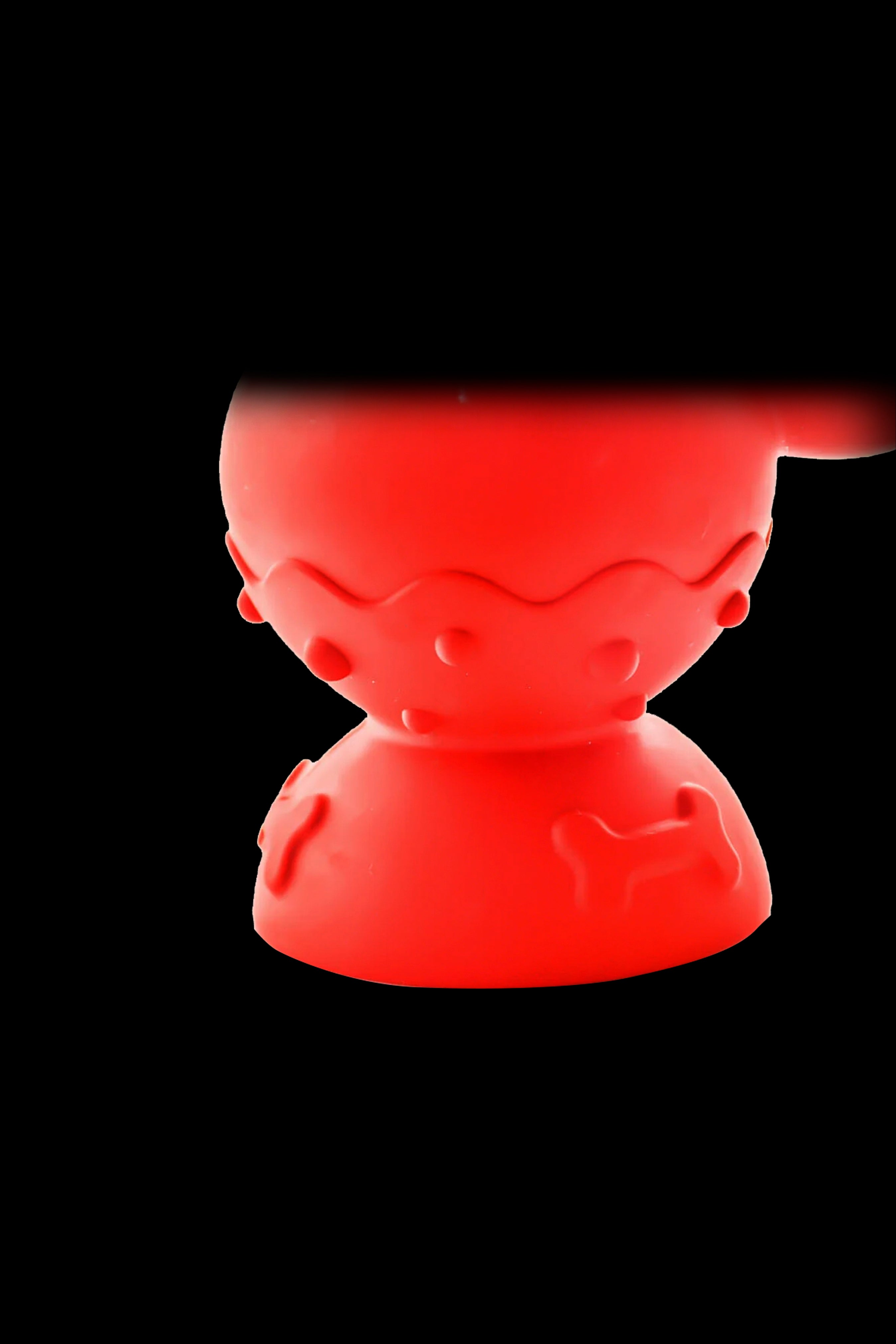 Red silicone cannabis concentrate container.
