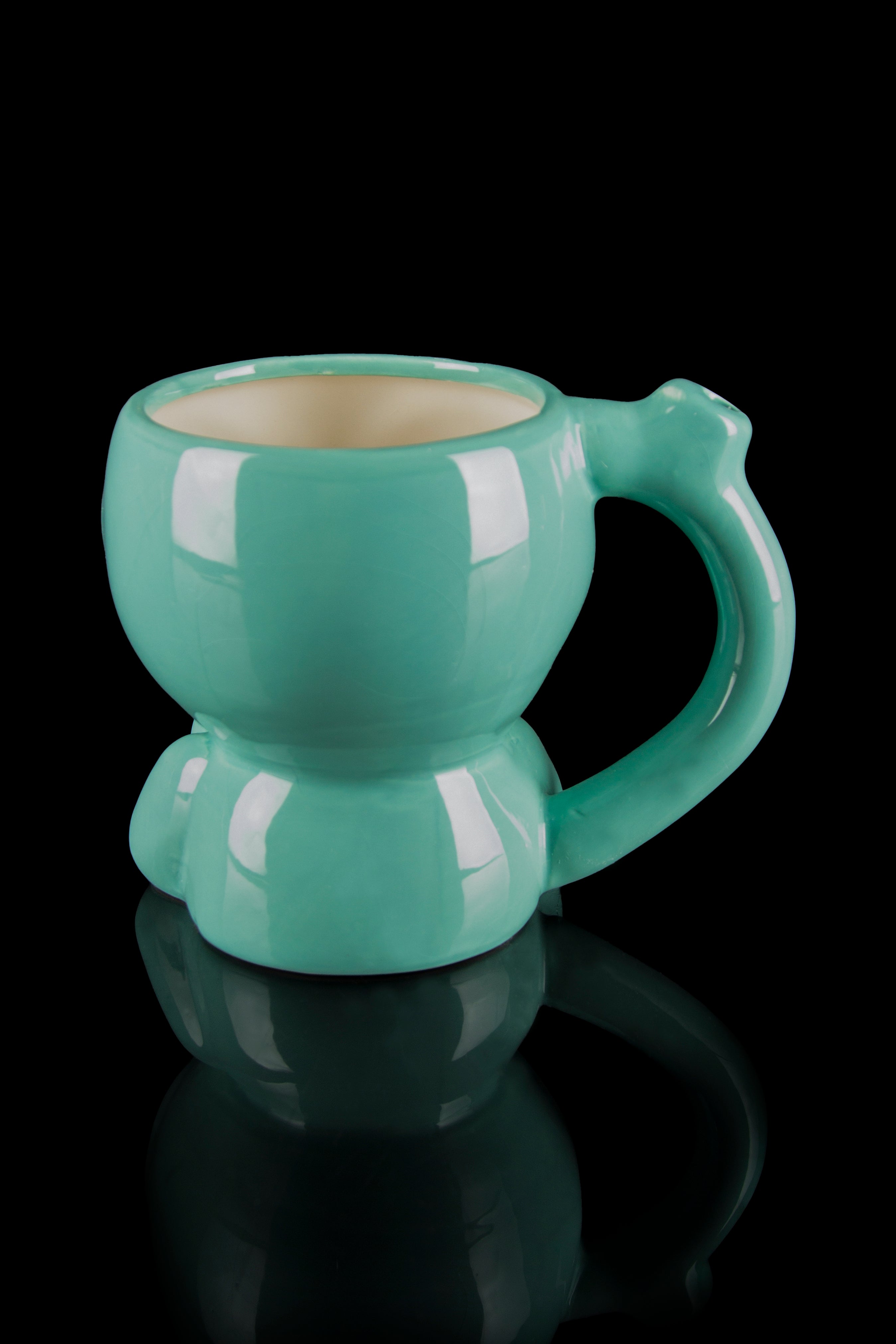 Teal ceramic smoking mug with a bulbous shape and reflective surface, isolated on black."