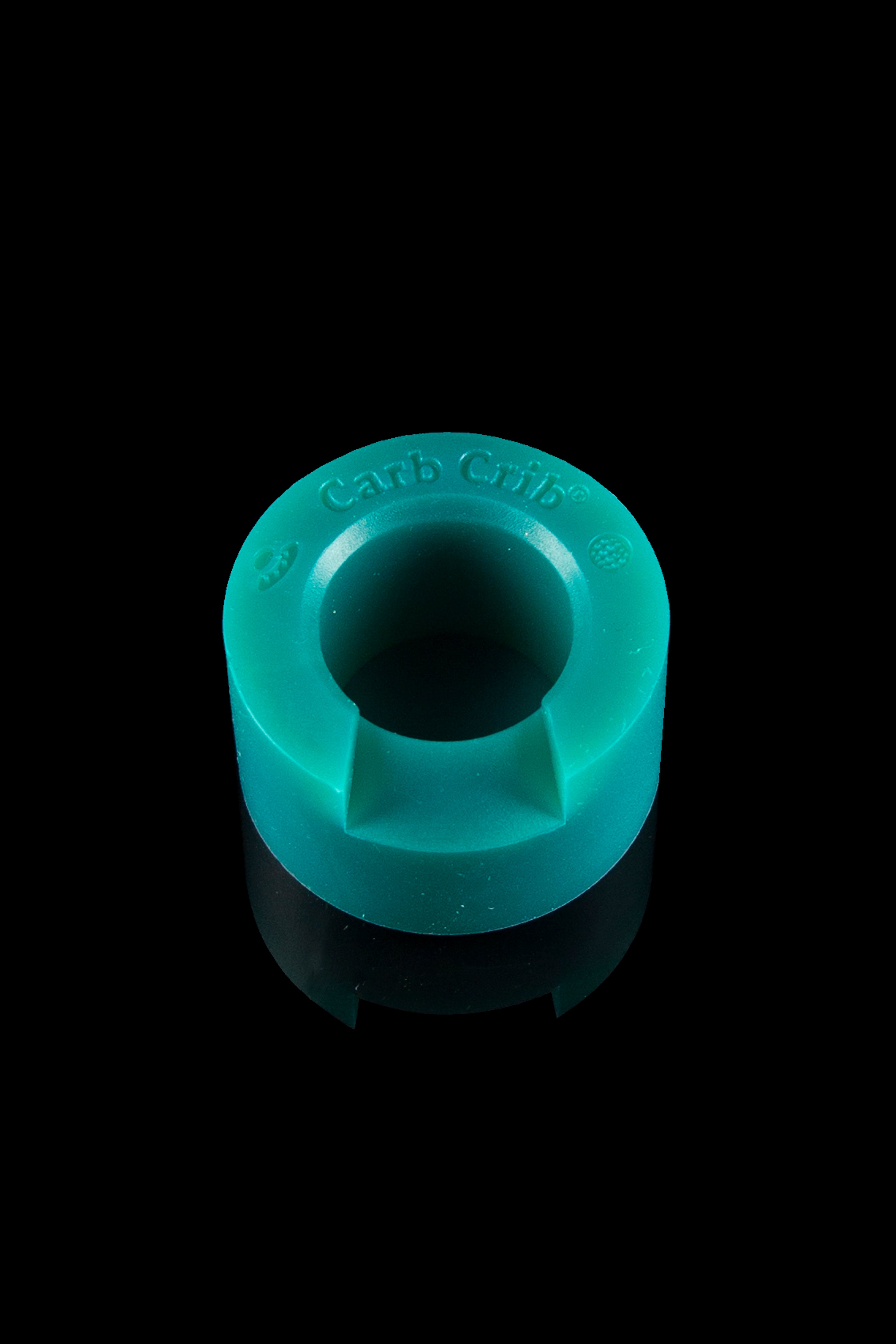 Turquoise cannabis carb cap isolated on a black background.