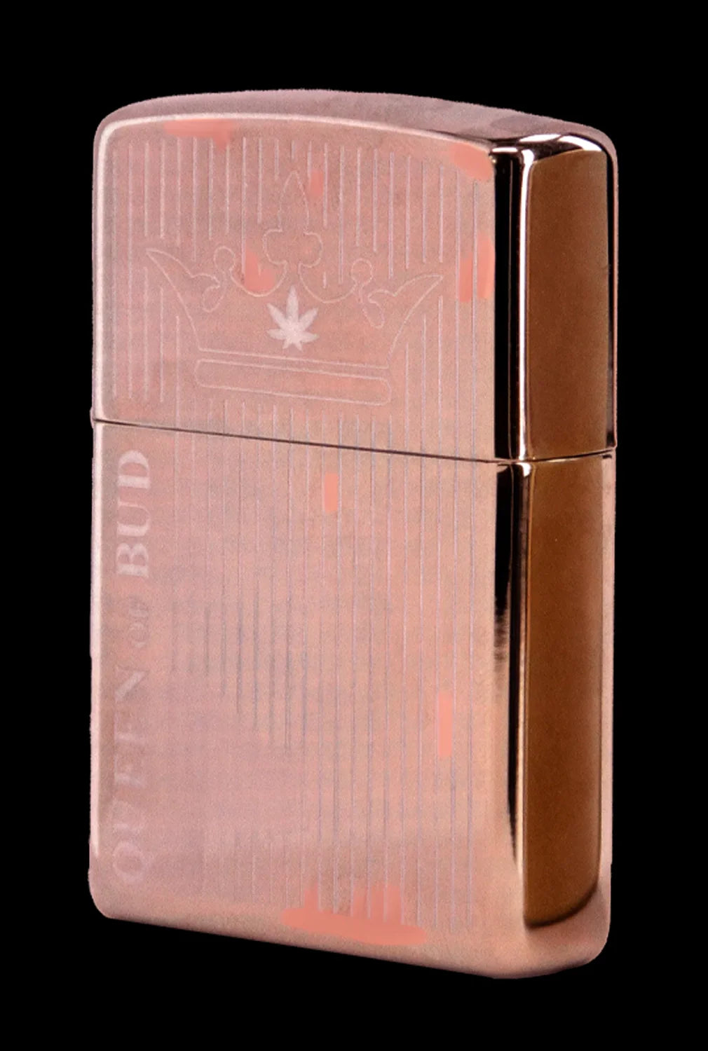 Copper-colored lighter engraved with a cannabis leaf and the text “OTTEN & BUD”.