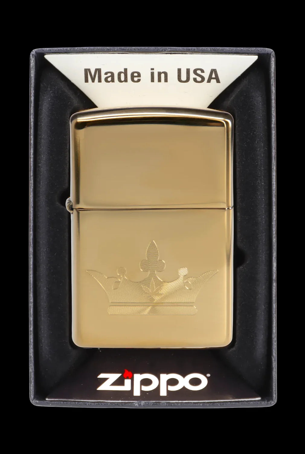 Gold Zippo lighter with engraved cannabis leaf design in its display case.