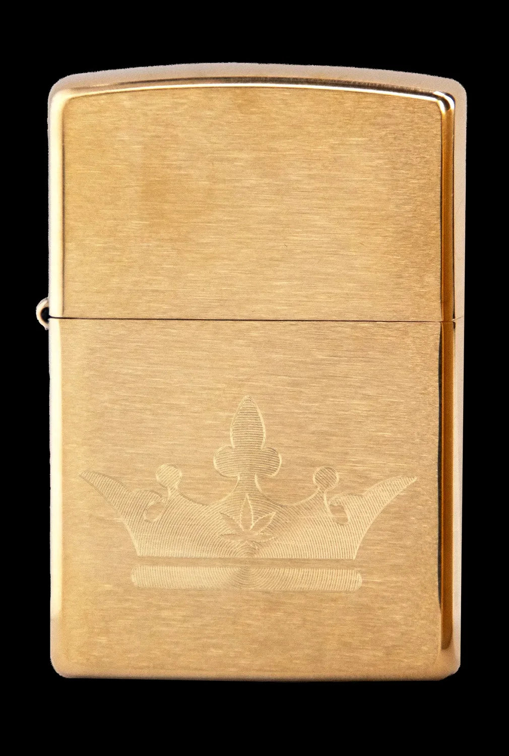 Gold Zippo lighter engraved with a cannabis flower design.