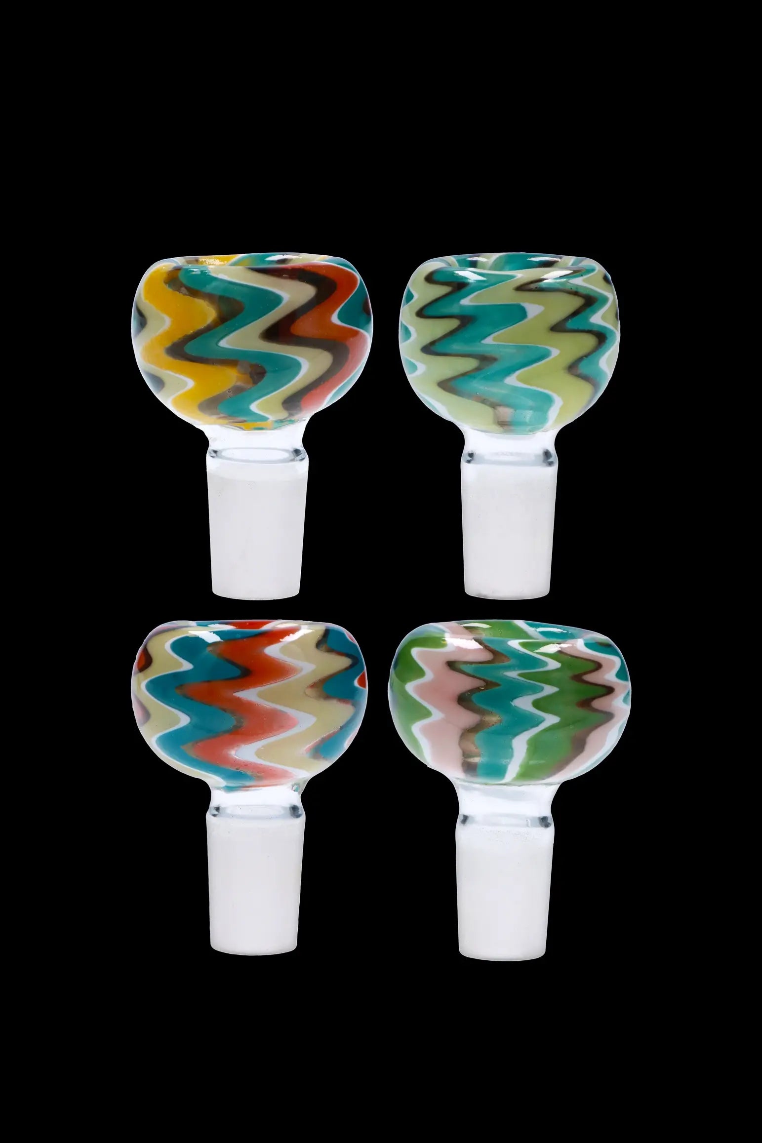 Four colorful glass bowls for smoking cannabis, displayed against a black background.