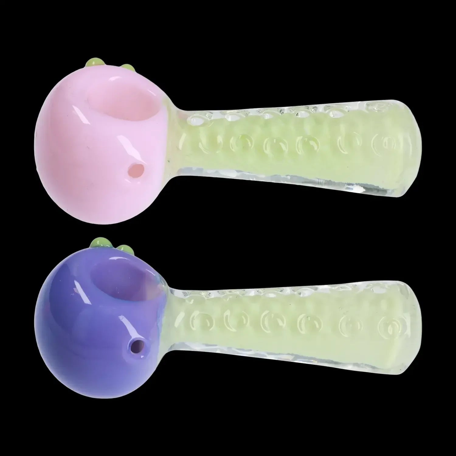 Two colorful glass smoking pipes, one pink and one purple, with textured green stems.