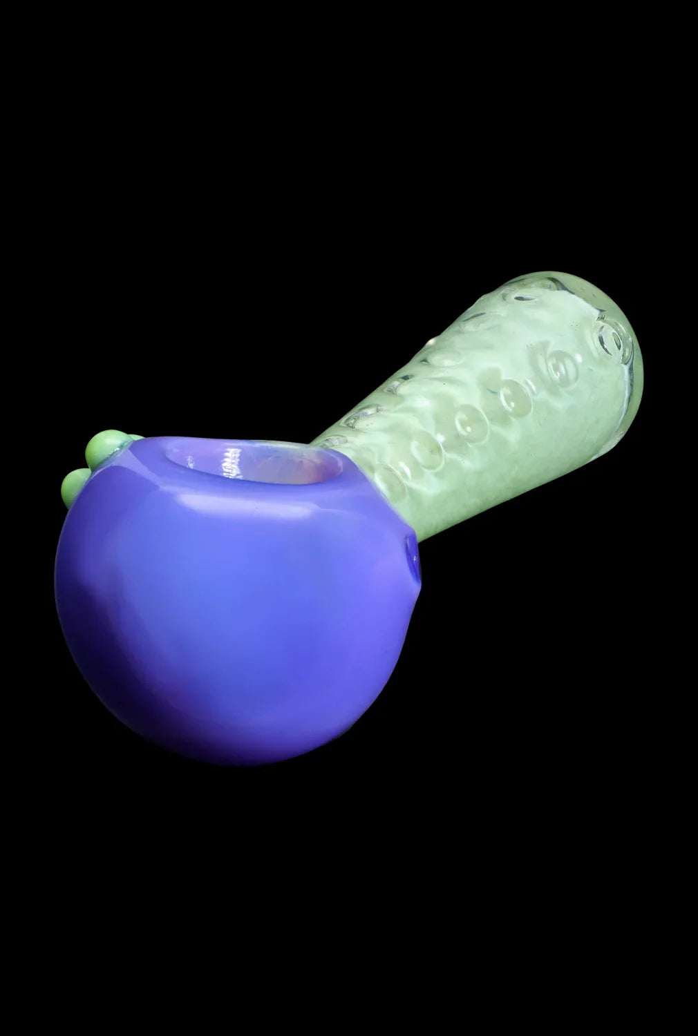 Blue and green glass pipe isolated on a black background.