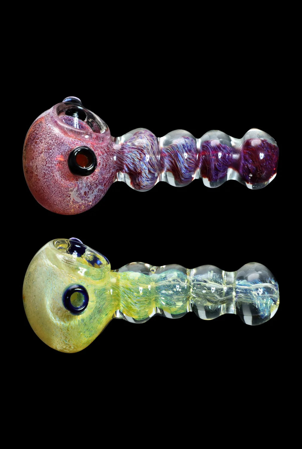 Two glass pipes with colorful, bubbled stems against a black background.