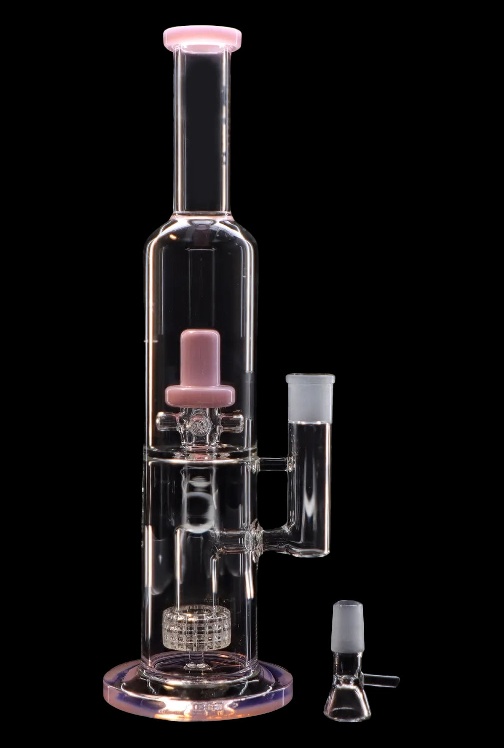 Clear glass water pipe (bong) with pink accents, featuring a percolator and separate bowl piece, isolated on a black background.