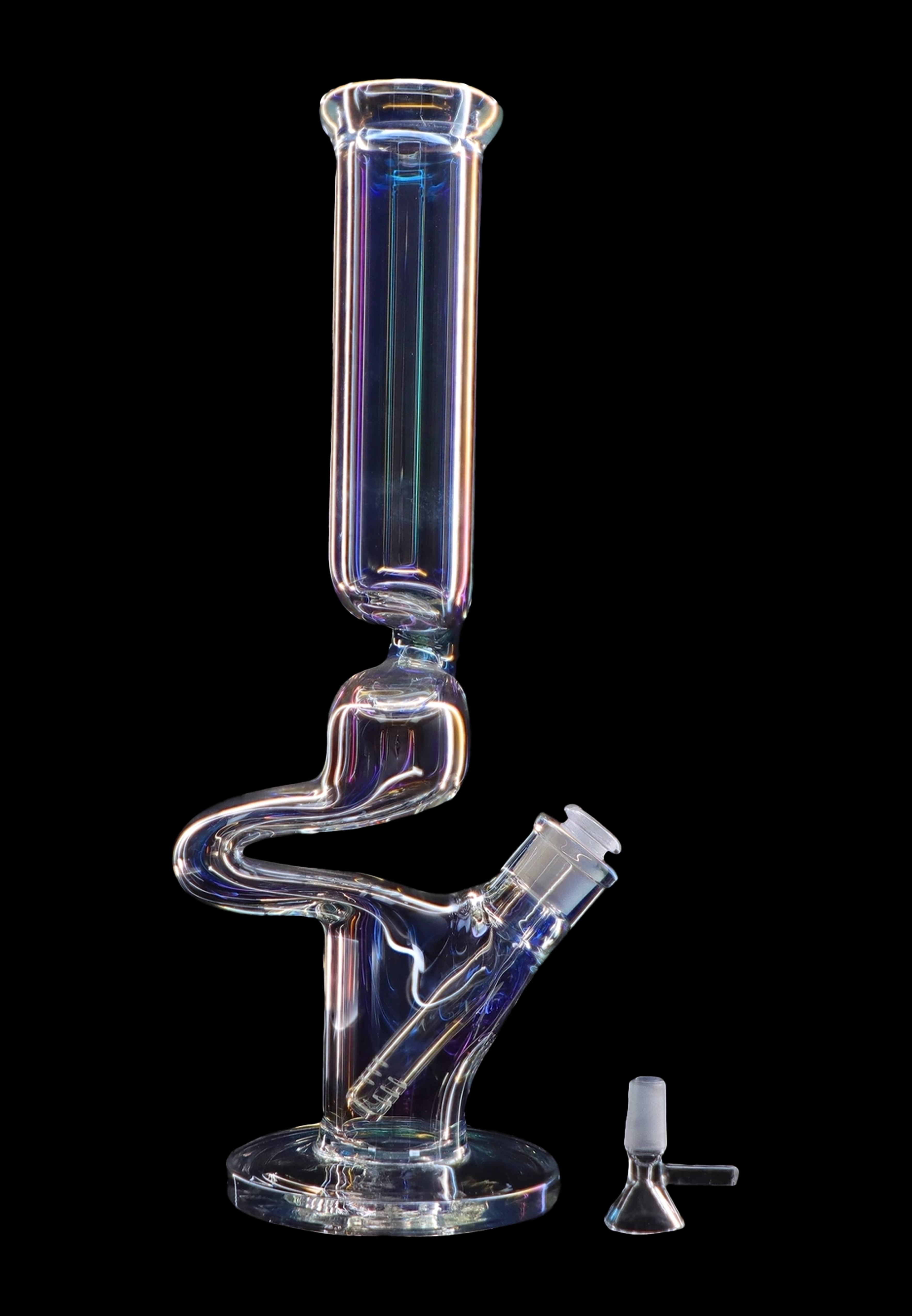 Clear glass water pipe (bong) with a complex, serpentine shape, illuminated with colorful lighting, and a small glass bowl beside it on a black background.